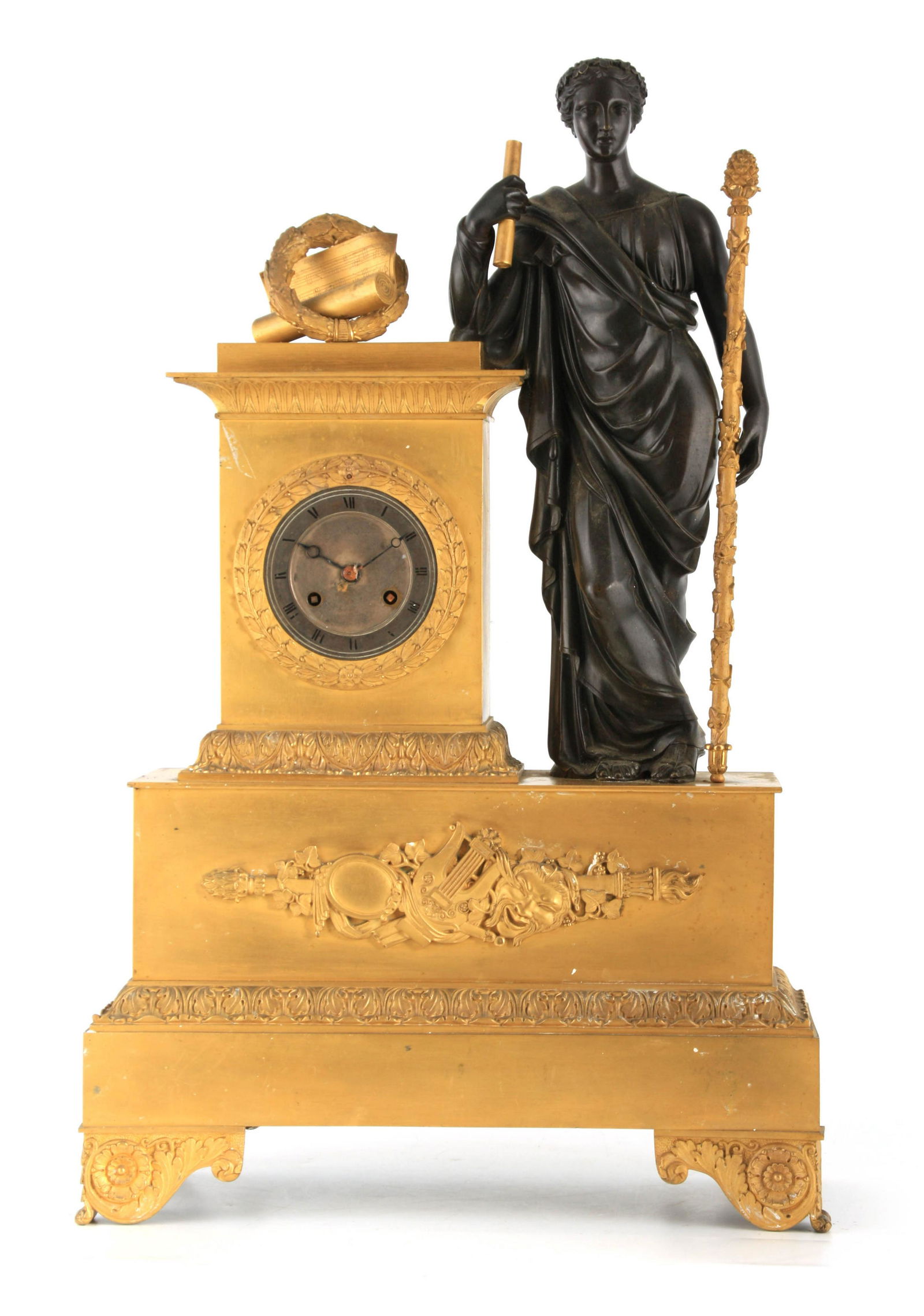 A LARGE 19TH CENTURY PATINATED BRONZE AND ORMOLU: A LARGE 19TH CENTURY PATINATED BRONZE AND ORMOLU FIGURAL MANTEL CLOCK modelled as a classical maiden holding a staff and scroll beside the clock case surmounted by a garland and rolled music sheet on