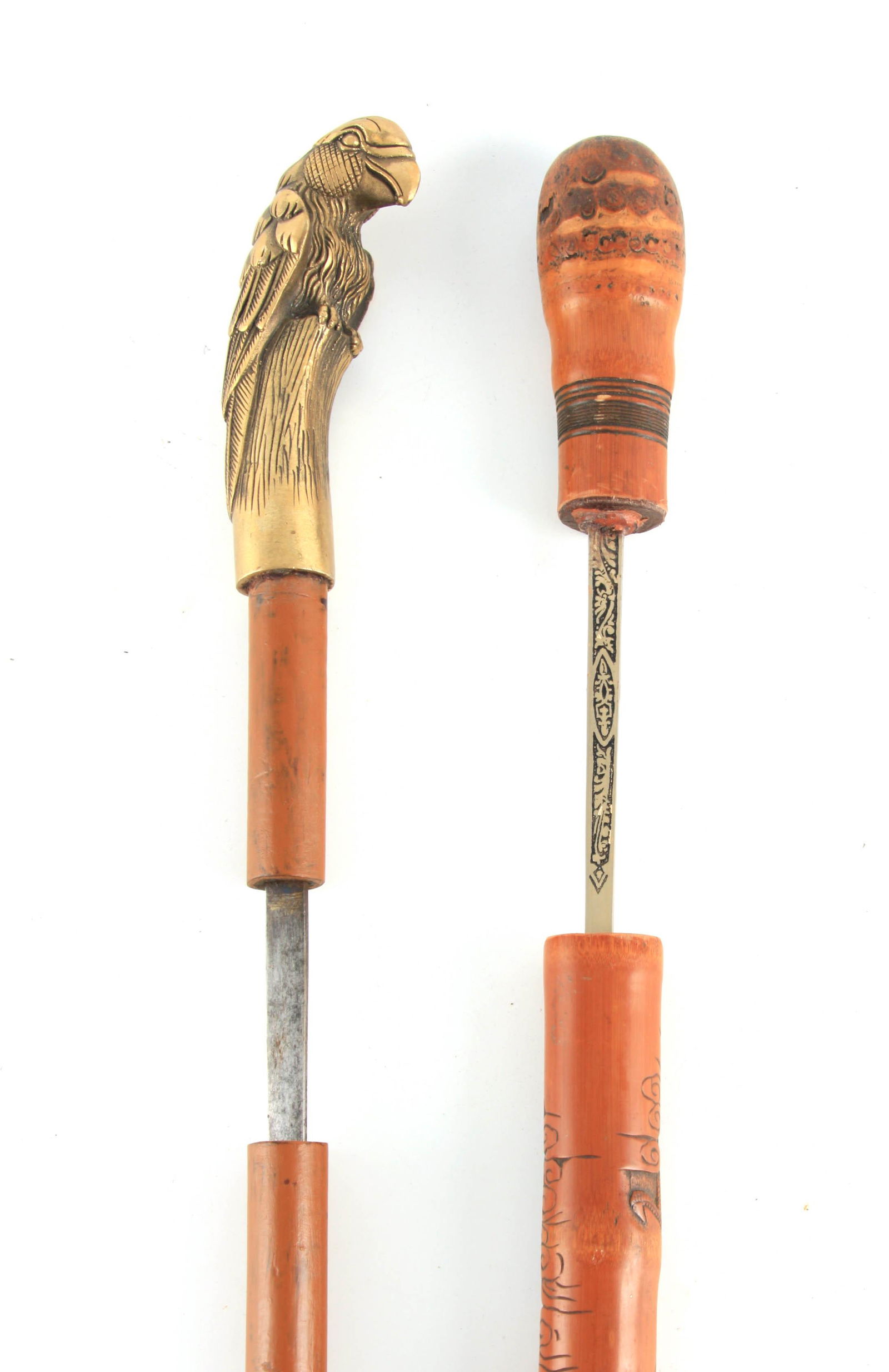 TWO EARLY 20TH CENTURY SWORD STICKS one having a brass (1 of 1)