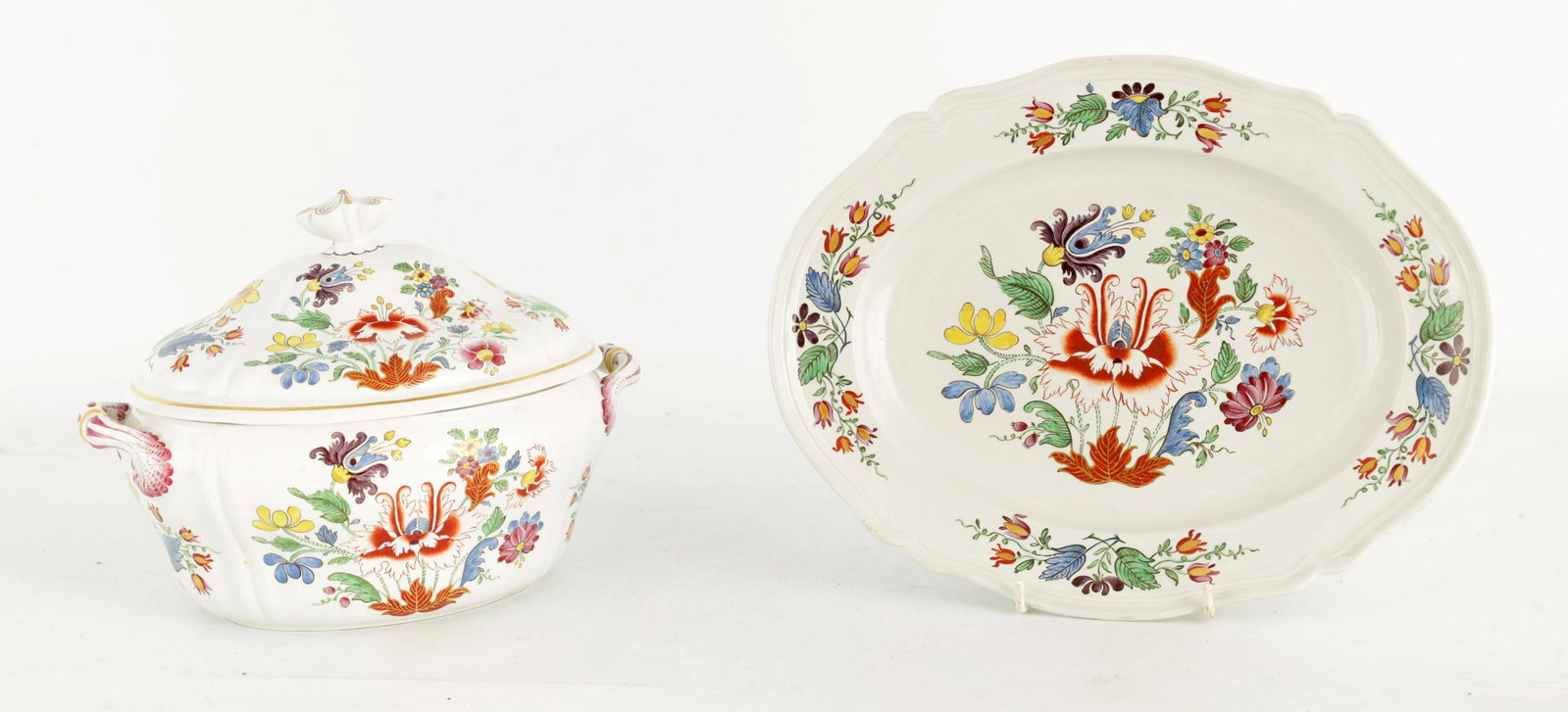 A LATE 18TH CENTURY DOCCIA PORCELAIN TUREEN, COVER: A LATE 18TH CENTURY DOCCIA PORCELAIN TUREEN, COVER AND STAND the tureen hand-painted in polychrome enamels with the Tulipano pattern of stylised flowering plants, with a similarly decorated shaped pla
