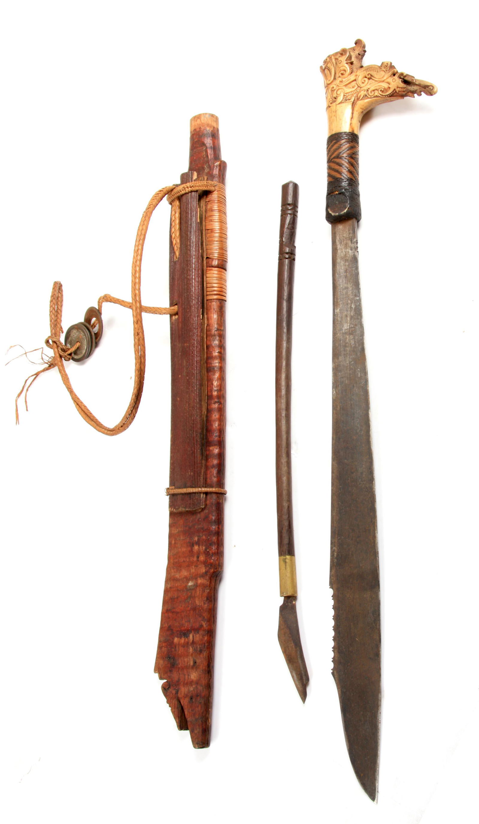 A 19TH CENTURY MODANG DAYAK MANDAU SWORD having a (1 of 1)