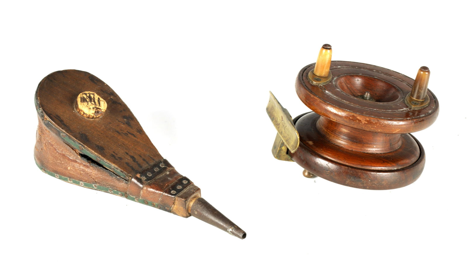 A 19TH CENTURY MAHOGANY FISHING REAL with brass mounts,: A 19TH CENTURY MAHOGANY FISHING REAL with brass mounts, and a set of 19th century powder bellows (the bellows 17cm overall )
