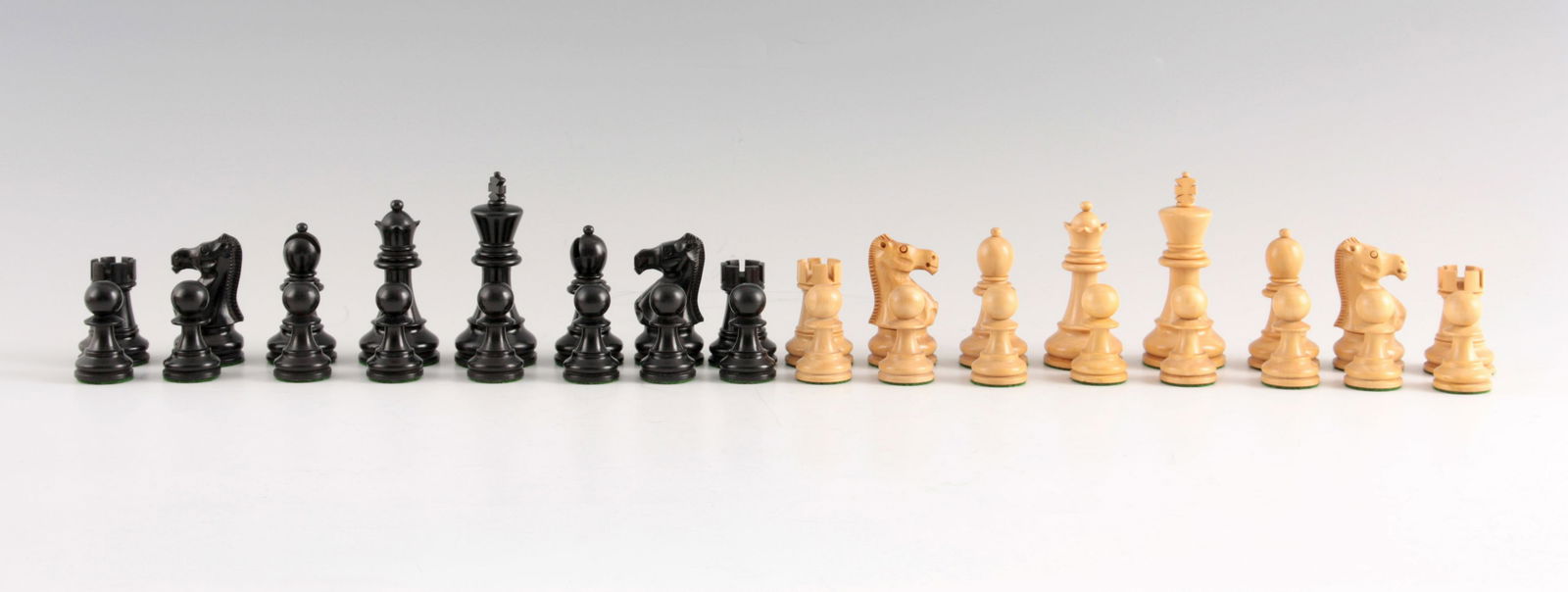 A TOURNAMENT SIZE STAUNTON TYPE WEIGHTED CHESS SET the (1 of 2)