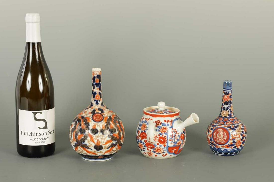 A COLLECTION OF THREE JAPANESE IMARI PORCELAIN ITEMS: A COLLECTION OF THREE JAPANESE IMARI PORCELAIN ITEMS A COLLECTION OF THREE JAPANESE IMARI PORCELAIN ITEMS including two bottle vases and a teapot. tallest 18cm high