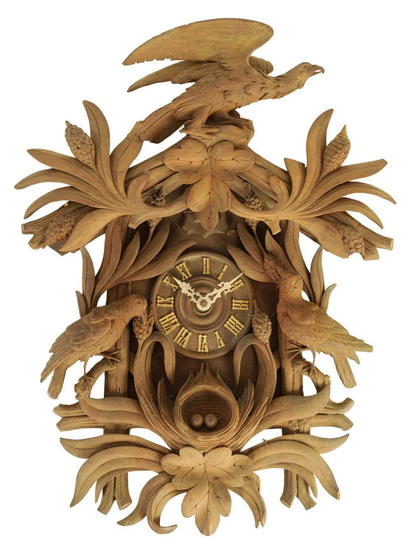 A 19TH CENTURY BLACK FOREST CUCKOO CLOCK decorated with birds and a nest, weight driven brass plated (1 of 1)