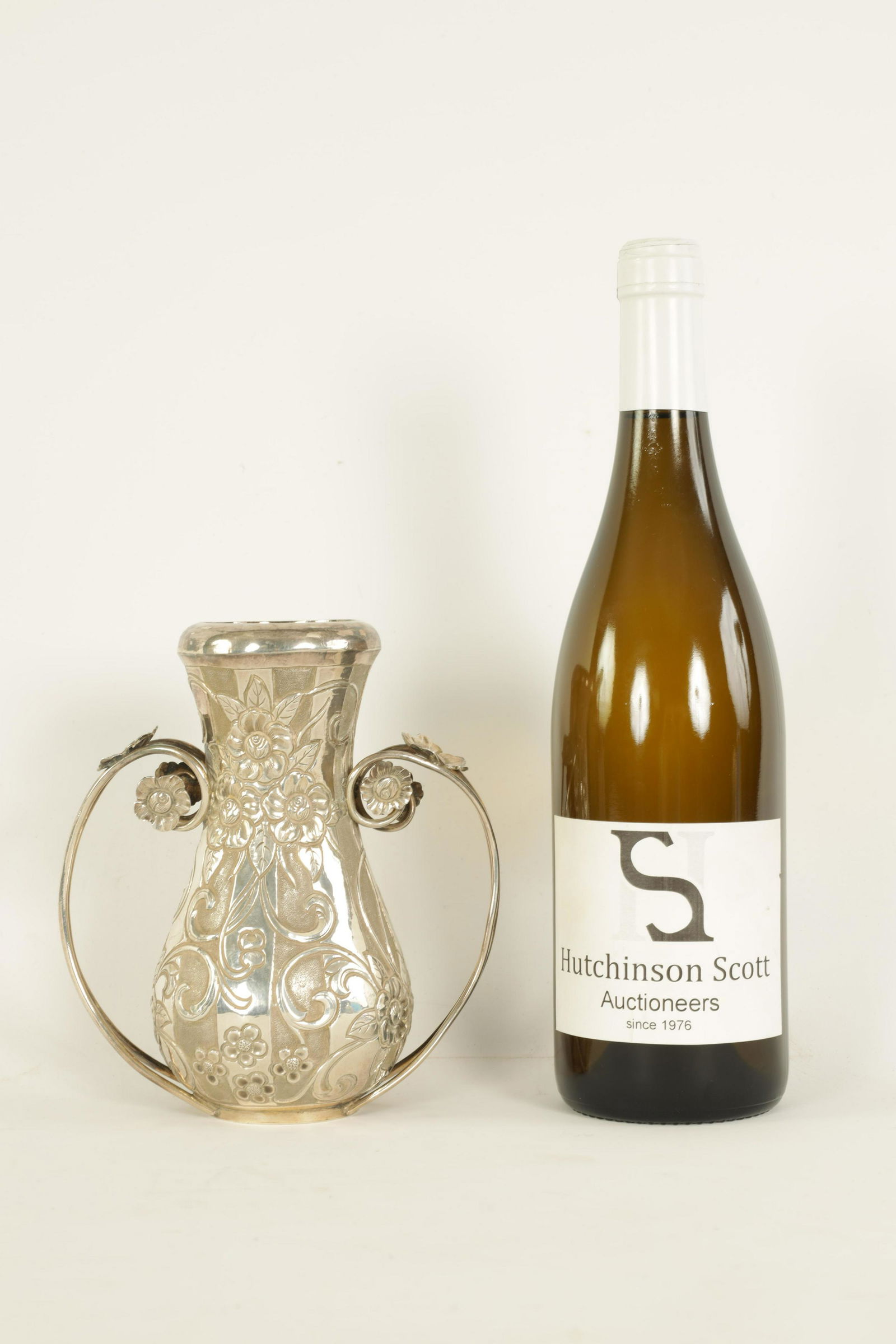 AN EARLY 20TH CENTURY EASTERN SILVER TWO HANDLED VASE (1 of 8)