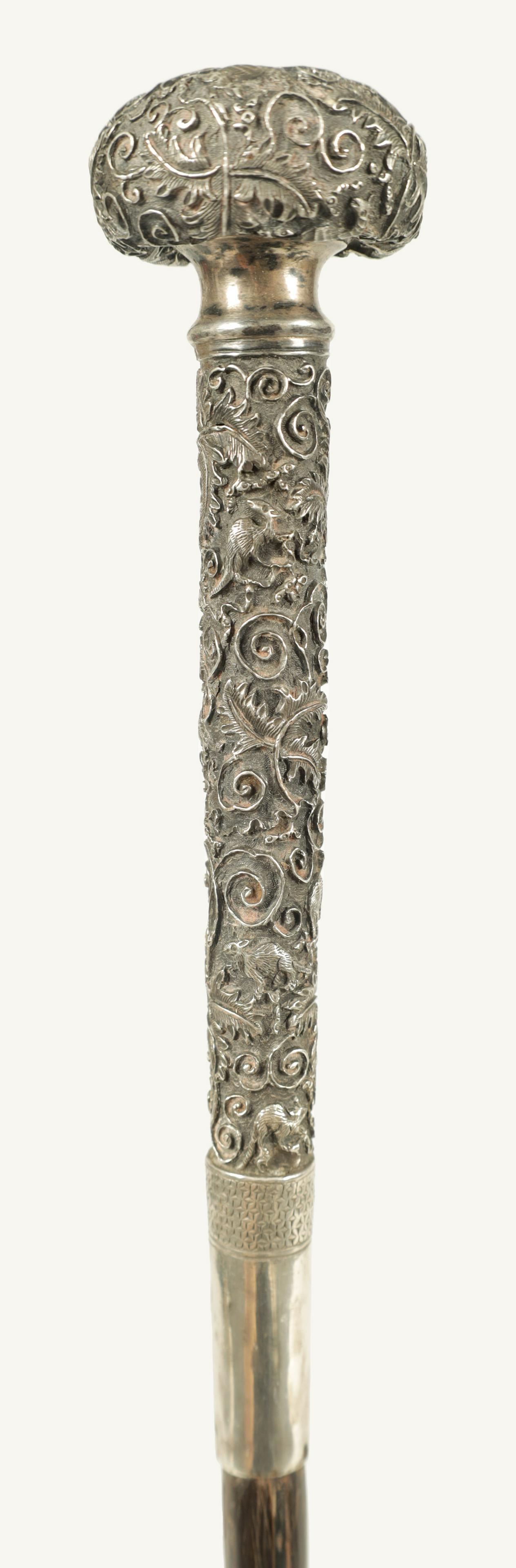 A LATE 19TH CENTURY CHINESE SILVER MOUNTED RHINOCEROS HORN WALKING CANE (1 of 5)