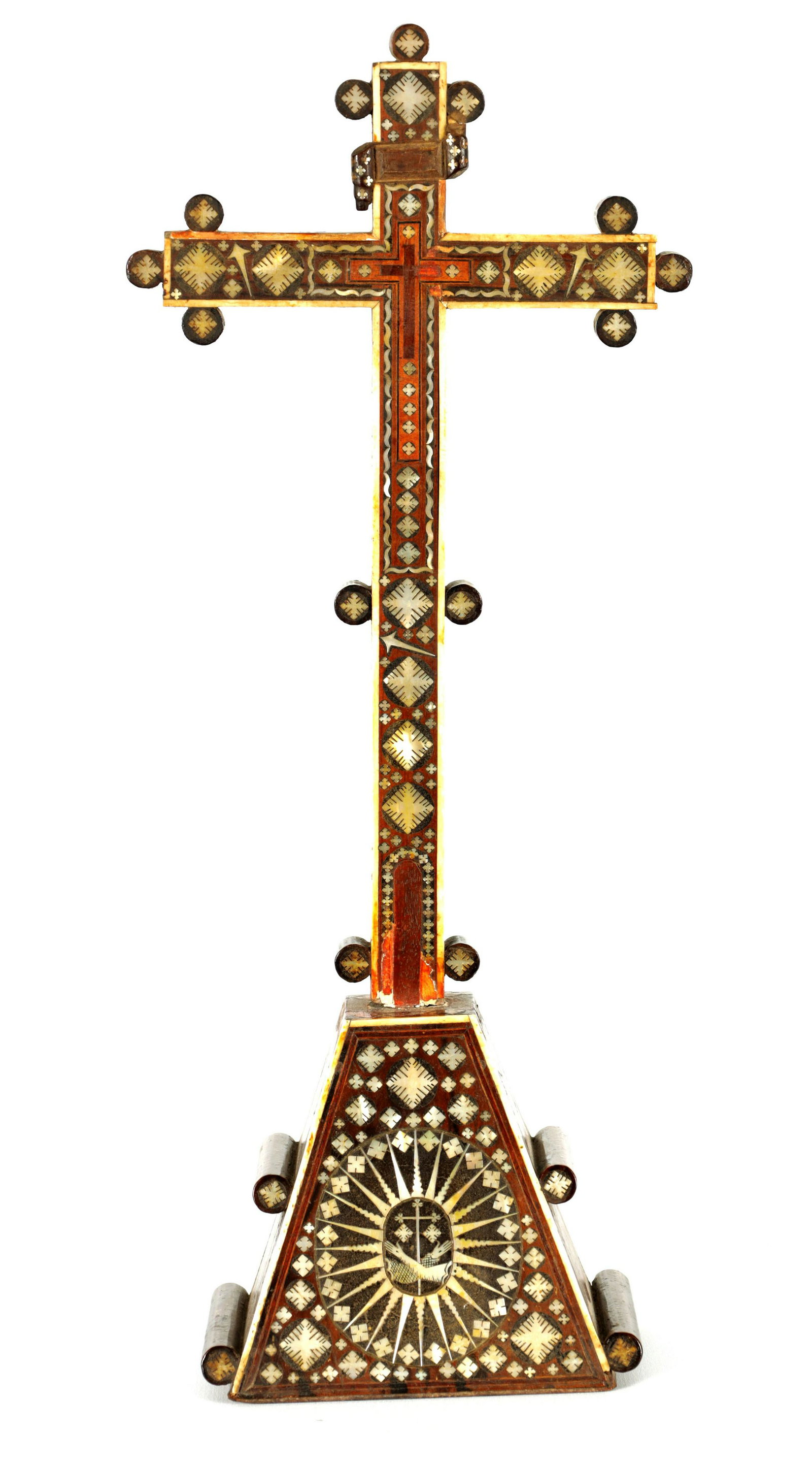 AN 18TH/19TH CENTURY INDO-PORTUGUESE MOTHER OF PEARL AND BONE-INLAID CRUCIFIX: AN 18TH/19TH CENTURY INDO PORTUGUESE MOTHER OF PEARL AND BONE-INLAID CRUCIFIX - on tapered platform base with turned side pieces (37cm high )