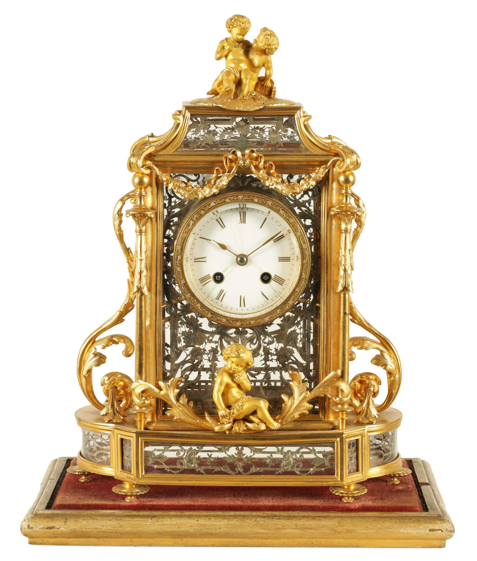 A LATE 19TH CENTURY FRENCH GLAZED ORMOLU MANTEL CLOCK The case surmounted by two ormolu cherubs (1 of 14)