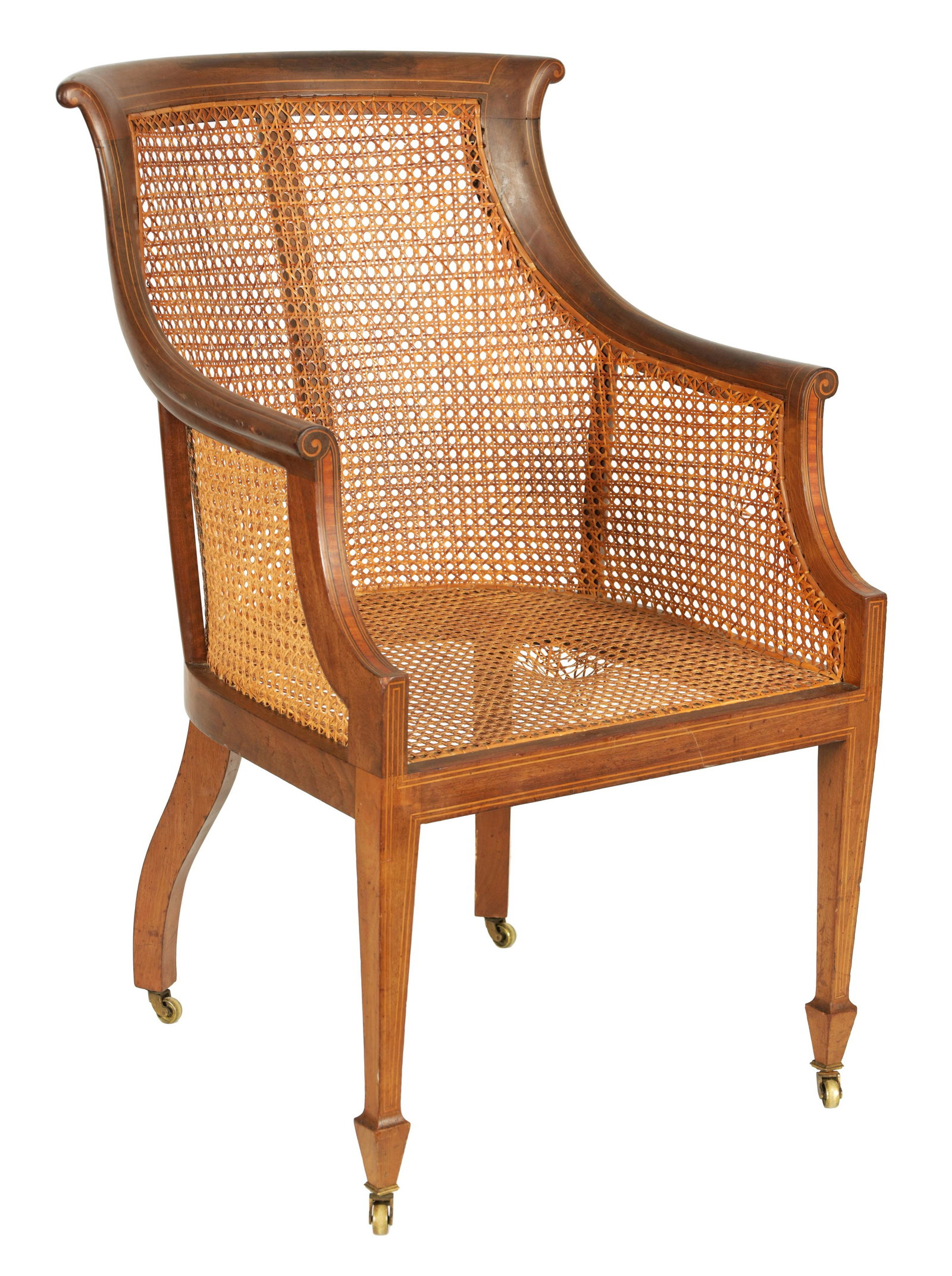 MAPLE & CO. A LATE 19TH CENTURY BOXWOOD STRUNG MAHOGANY BERGERE LIBRARY CHAIR with shaped back and (1 of 9)