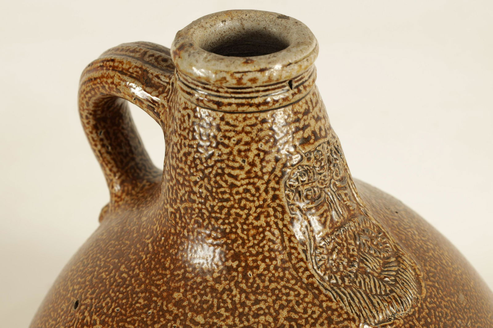 A 17TH CENTURY GERMAN STONEWARE BELLARMINE (1 of 7)