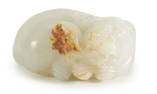 A 19TH CENTURY WHITE AND RUSET JADE CARVED SCULPTURE