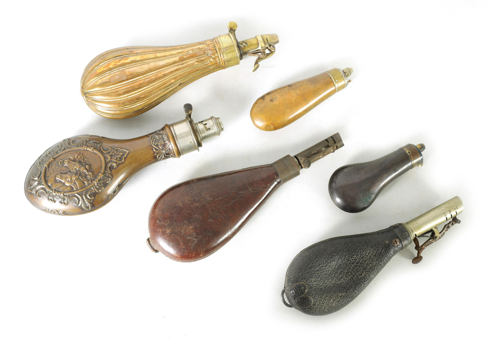 A COLLECTION OF FIVE 19TH CENTURY SHOT AND POWDER FLASKS: A COLLECTION OF FIVE 19TH CENTURY SHOT AND POWDER FLASKS (5)