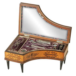 A MID 19TH CENTURY FRENCH MUSICAL INLAID SEWING BOX: A MID 19TH CENTURY FRENCH MUSICAL INLAID SEWING BOX formed as a miniature piano in birds eye maple inlaid with rosewood and boxwood raised on turned ebonised legs, the velvet-lined fitted interior