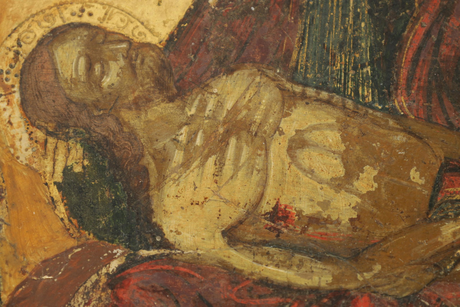 A 19TH CENTURY GREEK SCHOOL LAMENTATION ICON OIL ON PANEL: A 19TH CENTURY GREEK SCHOOL LAMENTATION ICON OIL ON PANEL depicting saints with Christ high-lighted in gilt (36cm wide 29cm high )