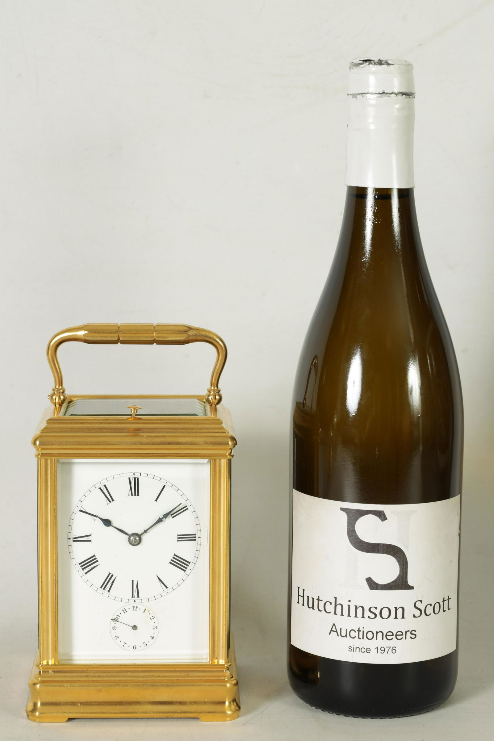 DROCOURT, PARIS. A 19TH CENTURY BRASS GORGE-CASE GRAND SONNERIE REPEATING CARRIAGE CLOCK WITH ALARM: DROCOURT, PARIS. A 19TH CENTURY BRASS GORGE-CASE GRAND SONNERIE REPEATING CARRIAGE CLOCK WITH ALARM the gilt brass moulded case enclosing a white enamel dial with Roman numerals and subsidiary alarm d