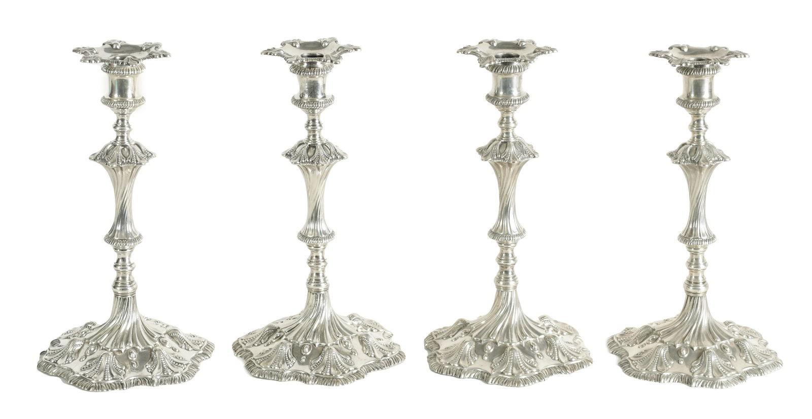 A FINE SET OF FOUR GEORGE III LARGE CAST SILVER TABLE CANDLE STICKS IN THE ROCOCO MANNER (1 of 20)