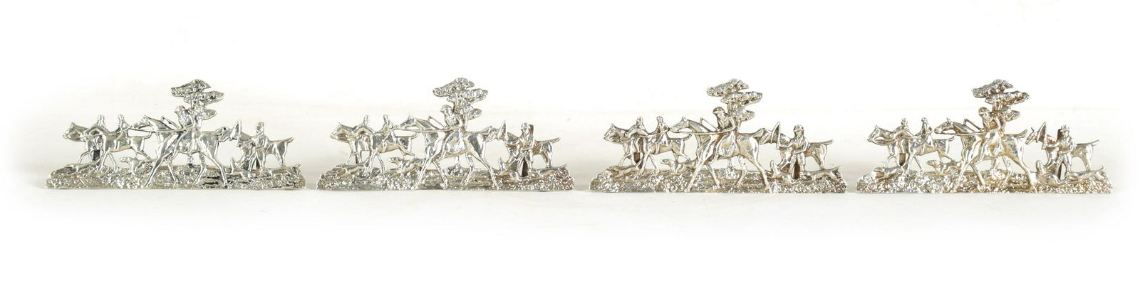 A SET OF FOUR LARGE CAST SILVER HUNTING SCENE MENU HOLDERS (1 of 8)