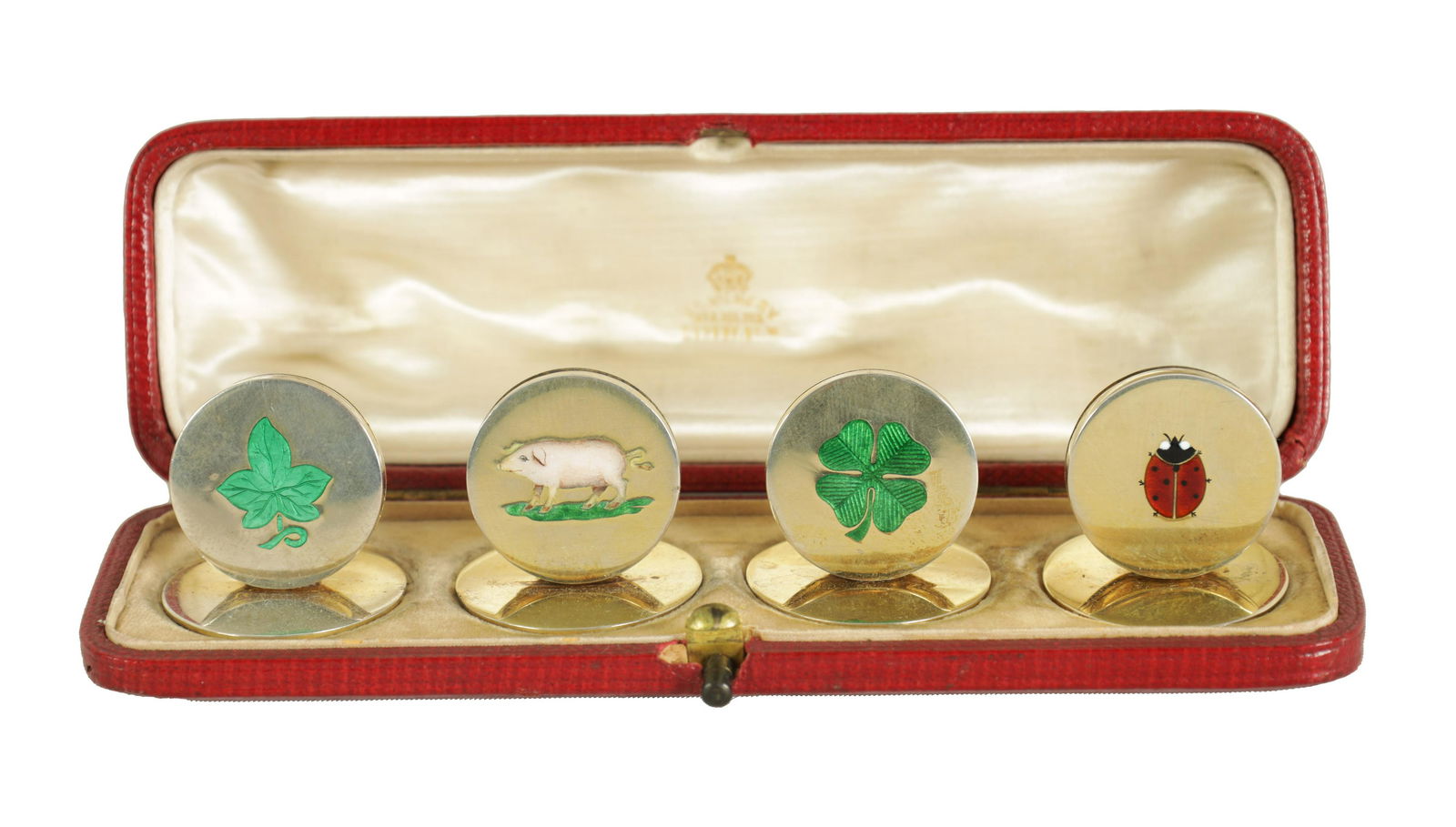 A RARE SET OF SILVER GILT AND ENAMEL 'LUCKY' MOTIF MENU HOLDERS (1 of 5)