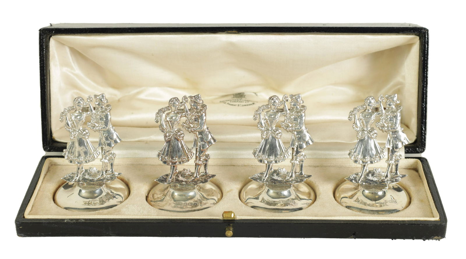 A CASED SET OF FOUR SILVER FIGURAL MENU HOLDERS (1 of 9)