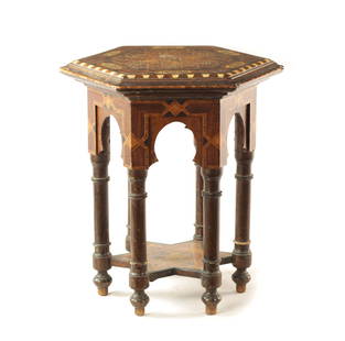 A LATE 19TH / EARLY 20TH CENTURY MOROCCAN MOORISH INLAID HEXAGONAL TABLE: A LATE 19TH / EARLY 20TH CENTURY MOROCCAN MOORISH INLAID HEXAGONAL TABLE having bone and parquetry inlaid table; raised on an arched turned base with under tier. (47cm high 43cm wide)
