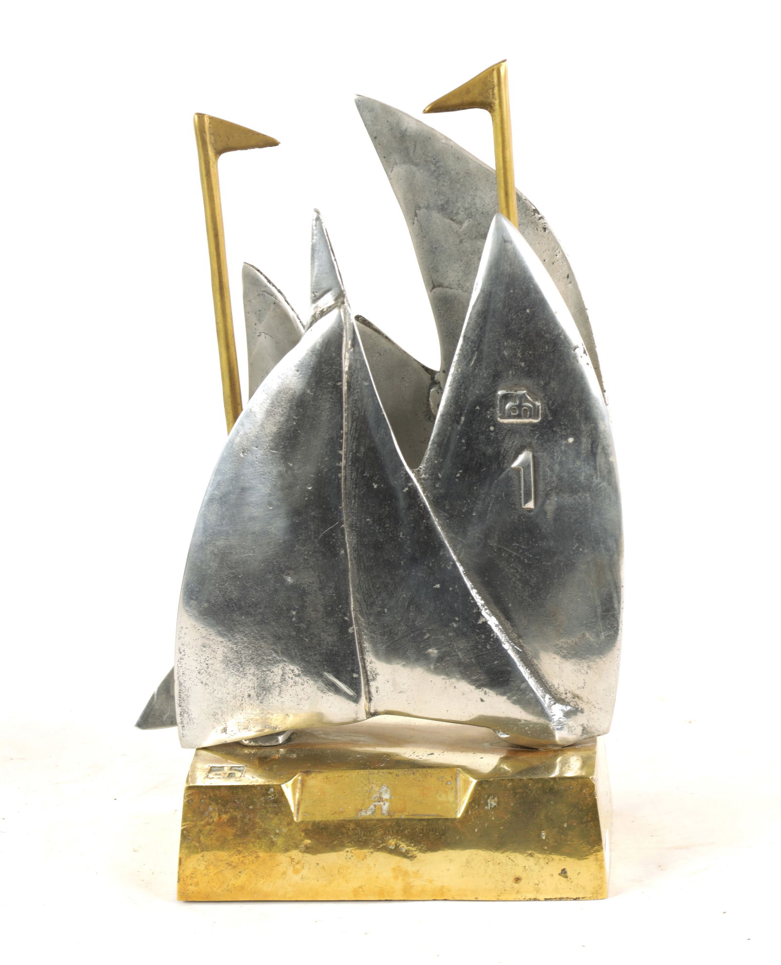 A STYLISH BRONZE AND STEEL MARITIME SCULPTURE: A STYLISH BRONZE AND STEEL MARITIME SCULPTURE, possibly a racing trophy, modelled as sailing boats with numbered sails mounted on a bronze rectangular base, makers impressed logo to base and sail. (33