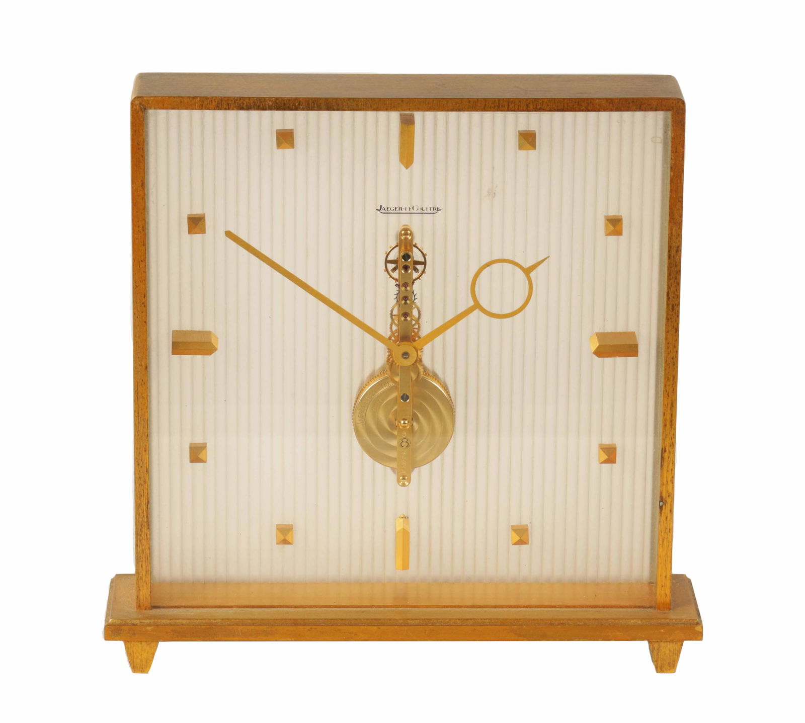 A MID 20TH CENTURY JAEGER-LECOULTRE MANTEL CLOCK: A MID 20TH CENTURY JAEGER-LECOULTRE MANTEL CLOCK the square gilt brass glazed case enclosing a corrugated dial with gilt markers and Swiis spring-driven eight-day inline movement (16cm high)