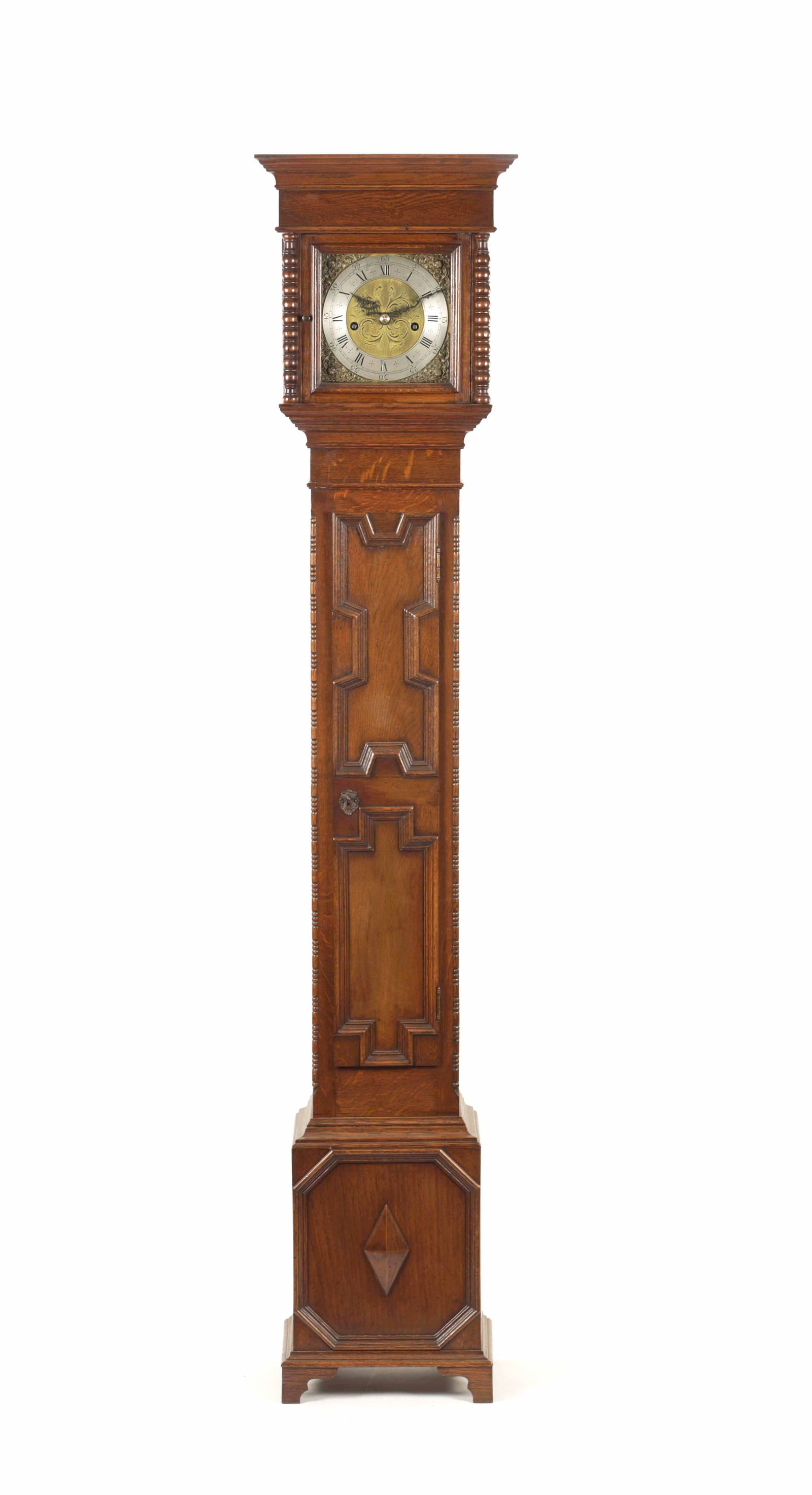 AN EDWARDIAN OAK CASED WEIGHT DRIVEN GRAND DAUGHTER CLOCK: AN EDWARDIAN OAK CASED WEIGHT DRIVEN GRAND DAUGHTER CLOCK the case with moulded pediment and turned pillars above a slender trunk with moulded door on box base. The 7" square brass dial with winged ch