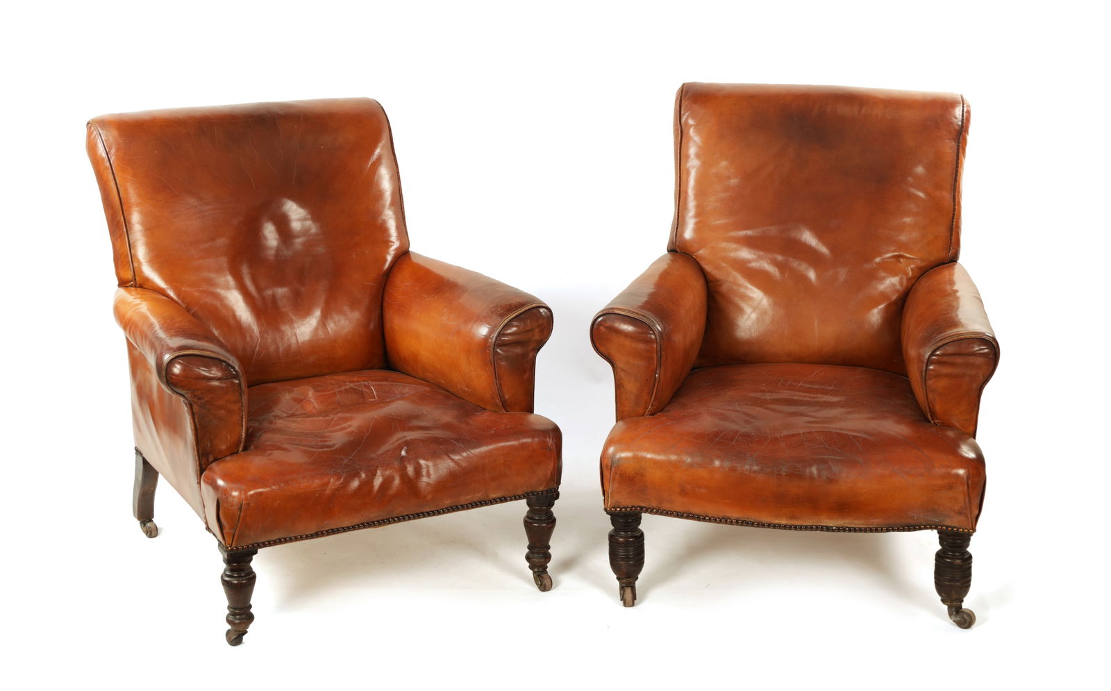 A PAIR OF 19TH CENTURY TAN LEATHER UPHOLSTERED ARMCHAIRS (1 of 1)