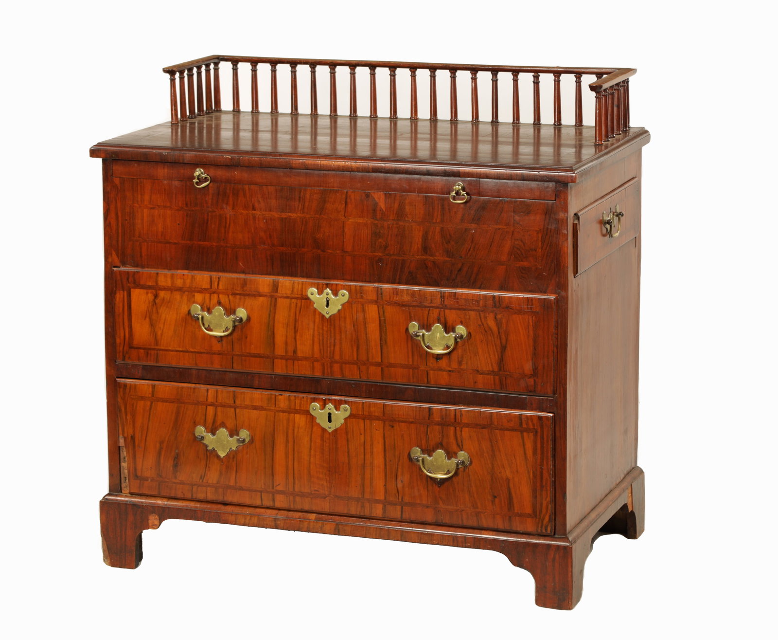 AN UNUSUAL GEORGE I AND LATER HERRING-BAND STRUNG AND FIGURED WALNUT BACHELORS CHEST: AN UNUSUAL GEORGE I AND LATER HERRING-BAND STRUNG AND FIGURED WALNUT BACHELORS CHEST the later galleried top above a brushing slide and fitted side drawers with two full-length graduated drawers to th