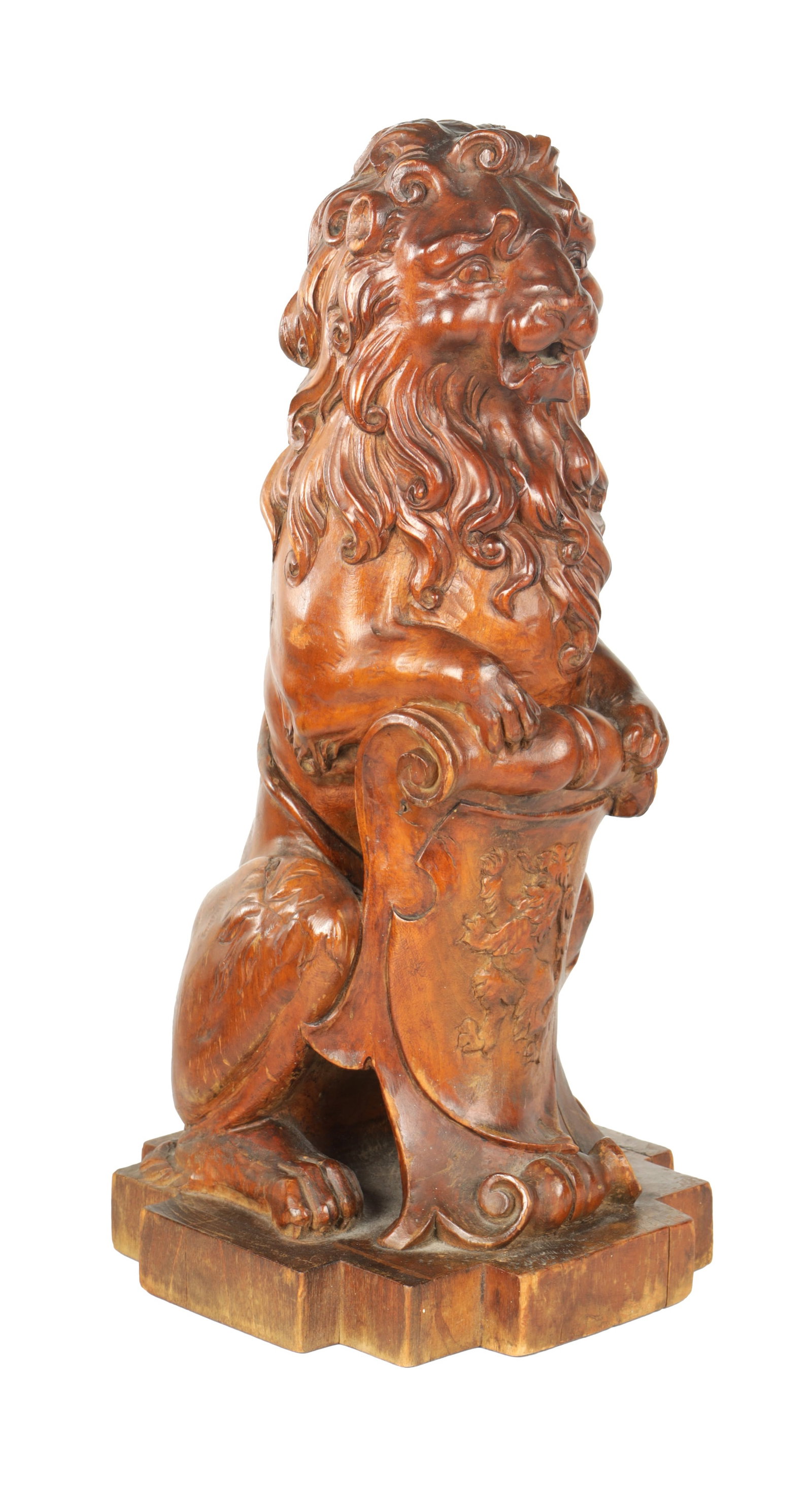 A GOOD LATE 19TH CENTURY CARVED WALNUT HERALDIC LION: A GOOD LATE 19TH CENTURY CARVED WALNUT HERALDIC LION resting on a shield with coat of arms and square shaped base (39cm high )