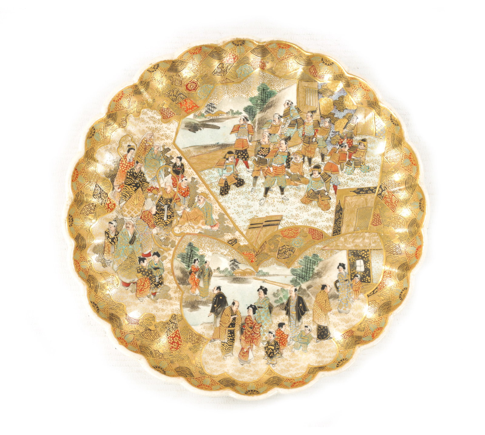 A JAPANESE MEIJI PERIOD SATSUMA CABINET PLATE: A JAPANESE MEIJI PERIOD SATSUMA CABINET PLATE A JAPANESE MEIJI PERIOD SATSUMA CABINET PLATE with scalloped edge decorated with panelled figural garden and pagoda scenes embellished with fanned gilt bo