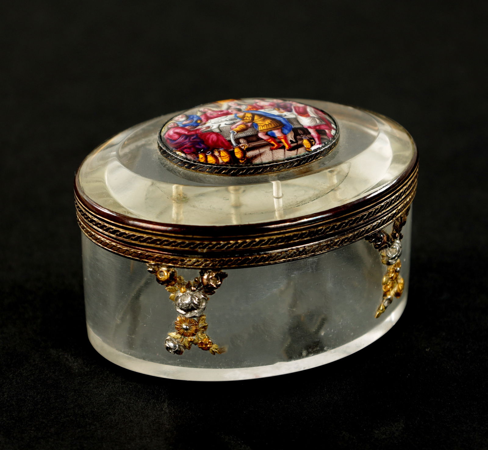A 19TH CENTURY CONTINENTAL GLASS AND ENAMEL ORMOLU-MOUNTED PILL BOX: A 19TH CENTURY CONTINENTAL GLASS AND ENAMEL ORMOLU-MOUNTED PILL BOX A 19TH CENTURY CONTINENTAL GLASS AND ENAMEL ORMOLU-MOUNTED PILL BOX with applied enamel plaque depicting a figural banqueting scene