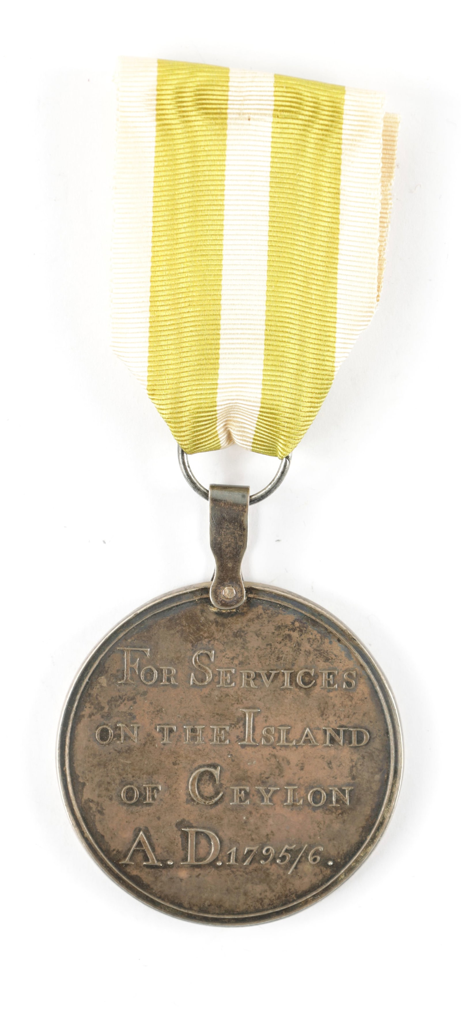 AN EAST INDIAN COMPANY CEYLON SILVER MEDAL 1795-96.: AN EAST INDIAN COMPANY CEYLON SILVER MEDAL 1795-96. AN EAST INDIAN COMPANY CEYLON SILVER MEDAL 1795-96. For Services ion the Island of Ceylon, the reverse with Persian script. Riveted suspension loop 