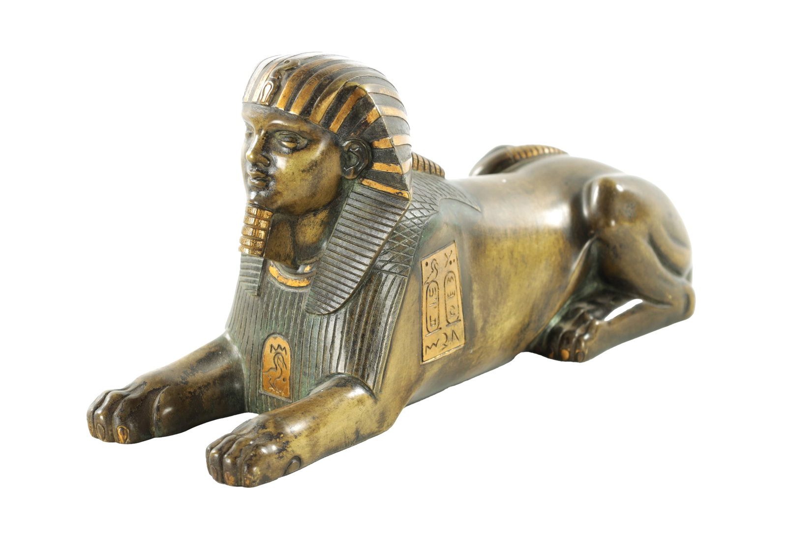 A 19TH CENTURY FRENCH EGYPTIAN REVIVAL BRONZE FIGURE OF A SEATED SPHINX: A 19TH CENTURY FRENCH EGYPTIAN REVIVAL BRONZE FIGURE OF A SEATED SPHINX A 19TH CENTURY FRENCH EGYPTIAN REVIVAL BRONZE FIGURE OF A SEATED SPHINX bearing engraved hieroglyphic plaques to the sides. (26c