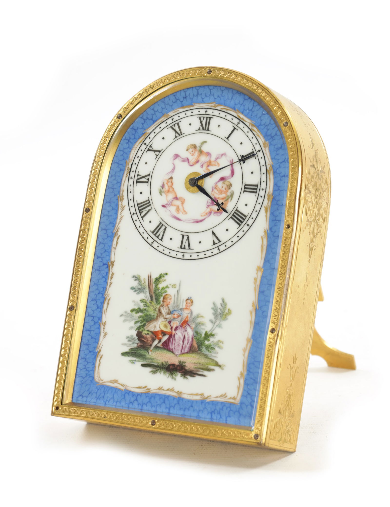 A LATE 19TH CENTURY THOMAS COLE STYLE STRUT CLOCK: A LATE 19TH CENTURY THOMAS COLE STYLE STRUT CLOCK A LATE 19TH CENTURY THOMAS COLE STYLE STRUT CLOCK having a gilt brass foliate engraved arched case enclosing a glazed enamel dial painted with classic