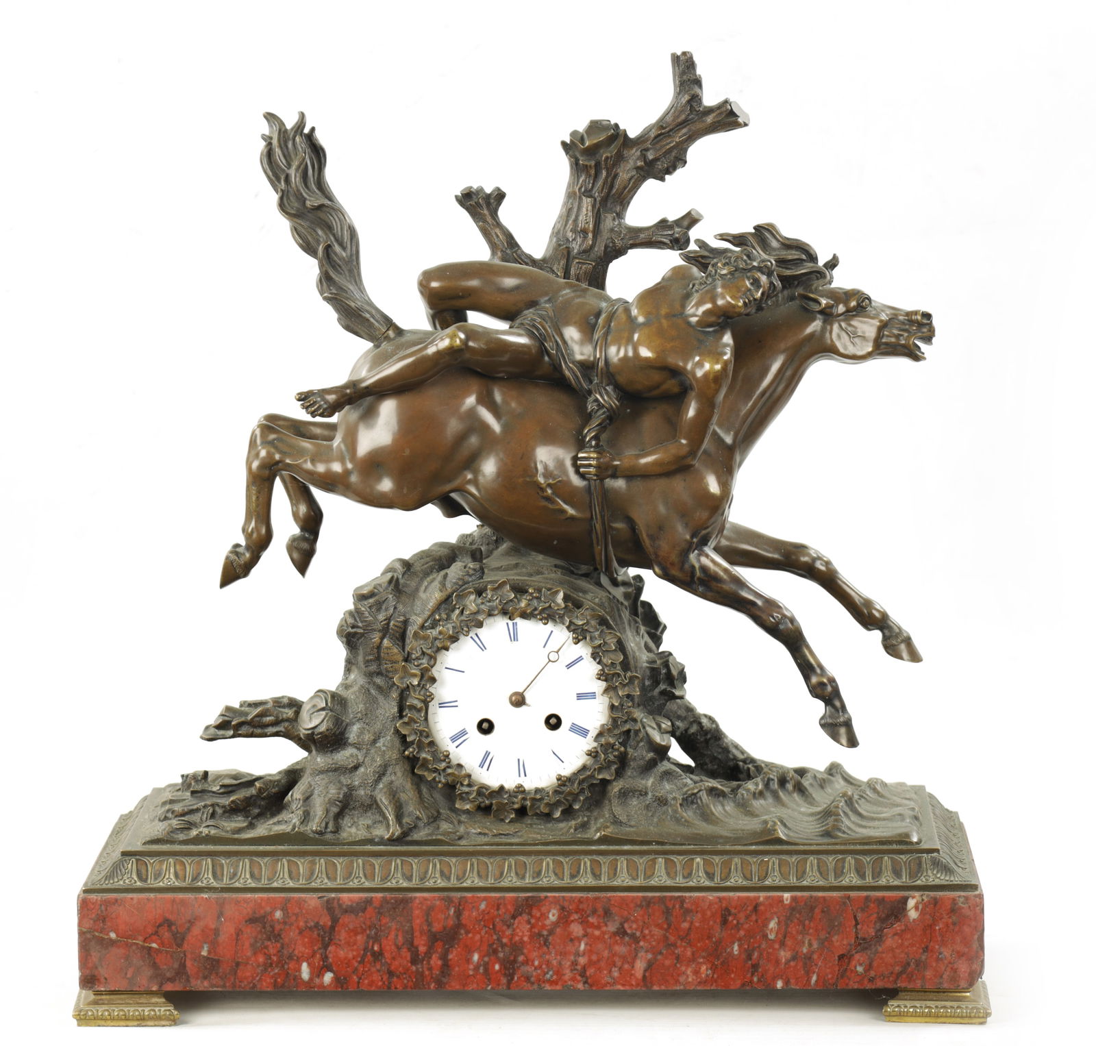 A LARGE LATE 19TH CENTURY FRENCH BRONZE AND ROUGE MARBLE MANTEL CLOCK: A LARGE LATE 19TH CENTURY FRENCH BRONZE AND ROUGE MARBLE MANTEL CLOCK A LARGE LATE 19TH CENTURY FRENCH BRONZE AND ROUGE MARBLE MANTEL CLOCK modelled as a semi-nude man riding a horse on a naturalistic