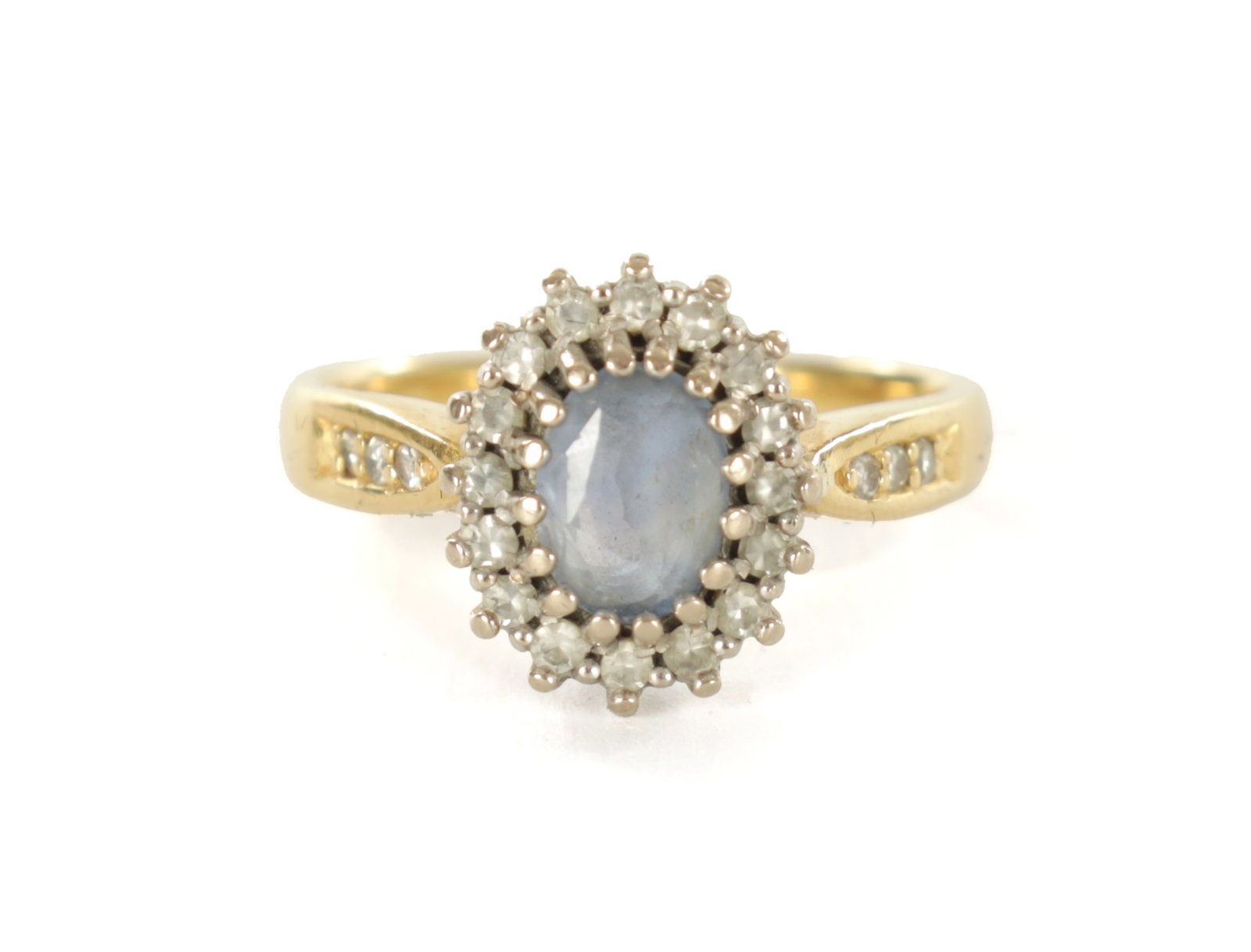 A LADIES 18CT GOLD SAPPHIRE AND DIAMOND RING: A LADIES 18CT GOLD SAPPHIRE AND DIAMOND RING The oval cut Ceylon sapphire surrounded by sixteen diamonds in a claw setting, total weight app. 4.7g, ring size M. - comes with insurance valuation dated 