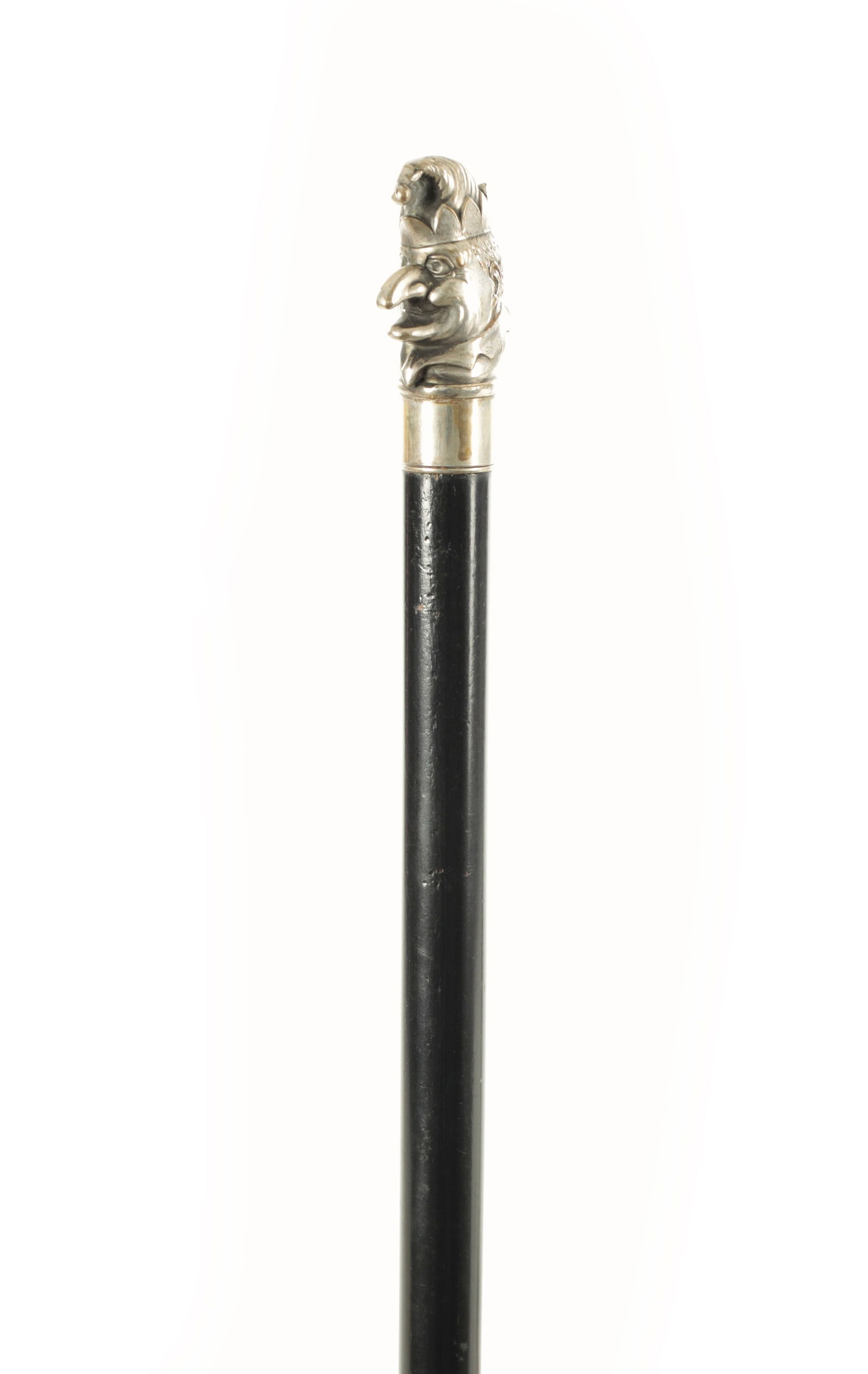 A SILVERED METAL MOUNTED 'MR PUNCH' WALKING CANE (1 of 4)