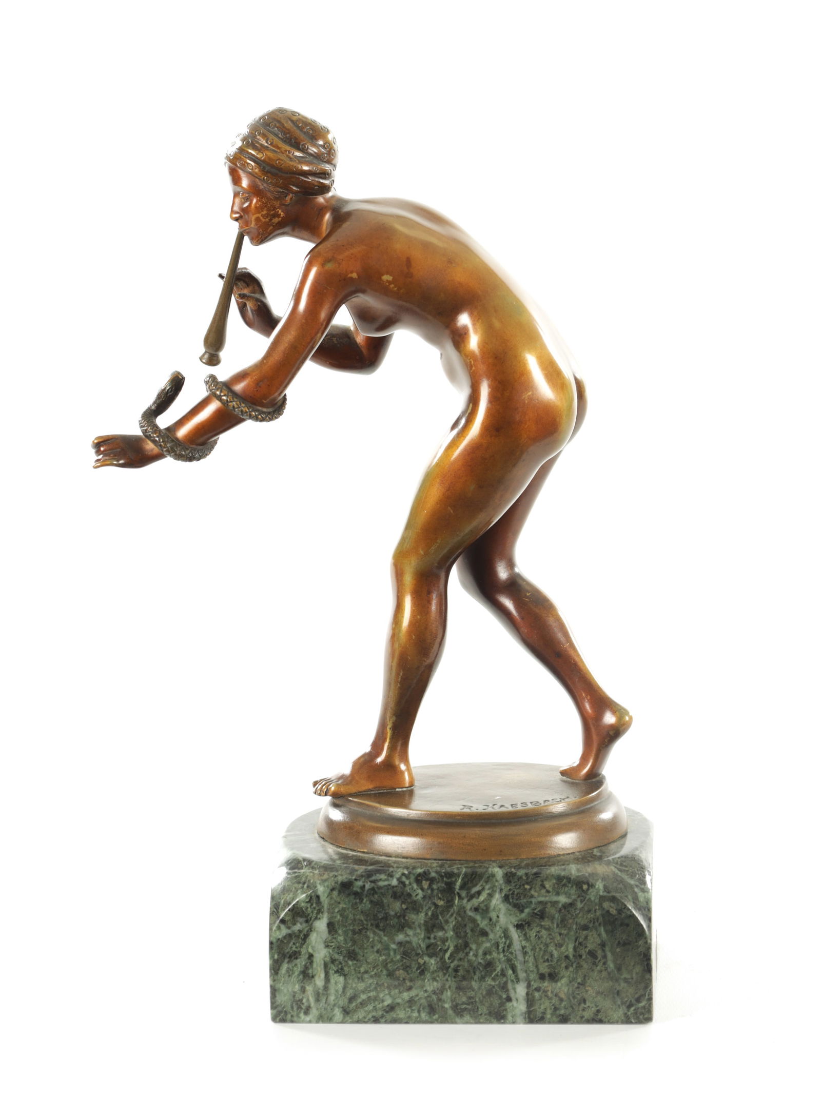 AFTER RUDOLF KAESBACH (1873-1955) A BRONZE FIGURAL SCULPTURE OF A SNAKE CHARMER: AFTER RUDOLF KAESBACH (1873-1955) A BRONZE FIGURAL SCULPTURE OF A SNAKE CHARMER mounted on a verdi antico marble base. (30cm high)