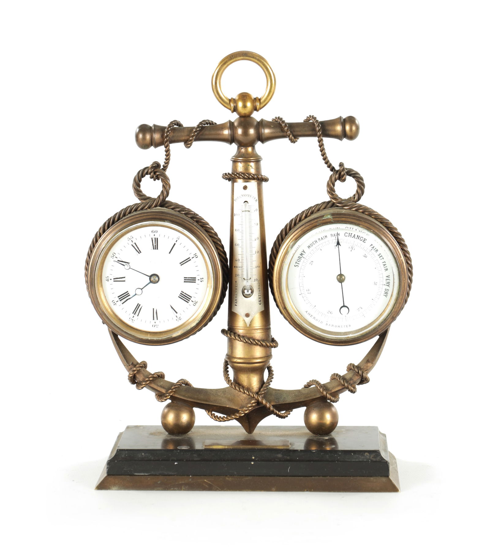 A LATE 19TH CENTURY FRENCH INDUSTRIAL NOVELTY DESK CLOCK COMPENDIUM: A LATE 19TH CENTURY FRENCH INDUSTRIAL NOVELTY DESK CLOCK COMPENDIUM modelled as an anchor supporting an eight-day clock with an enamel dial and matching aneroid barometer, the centre thermometer mount