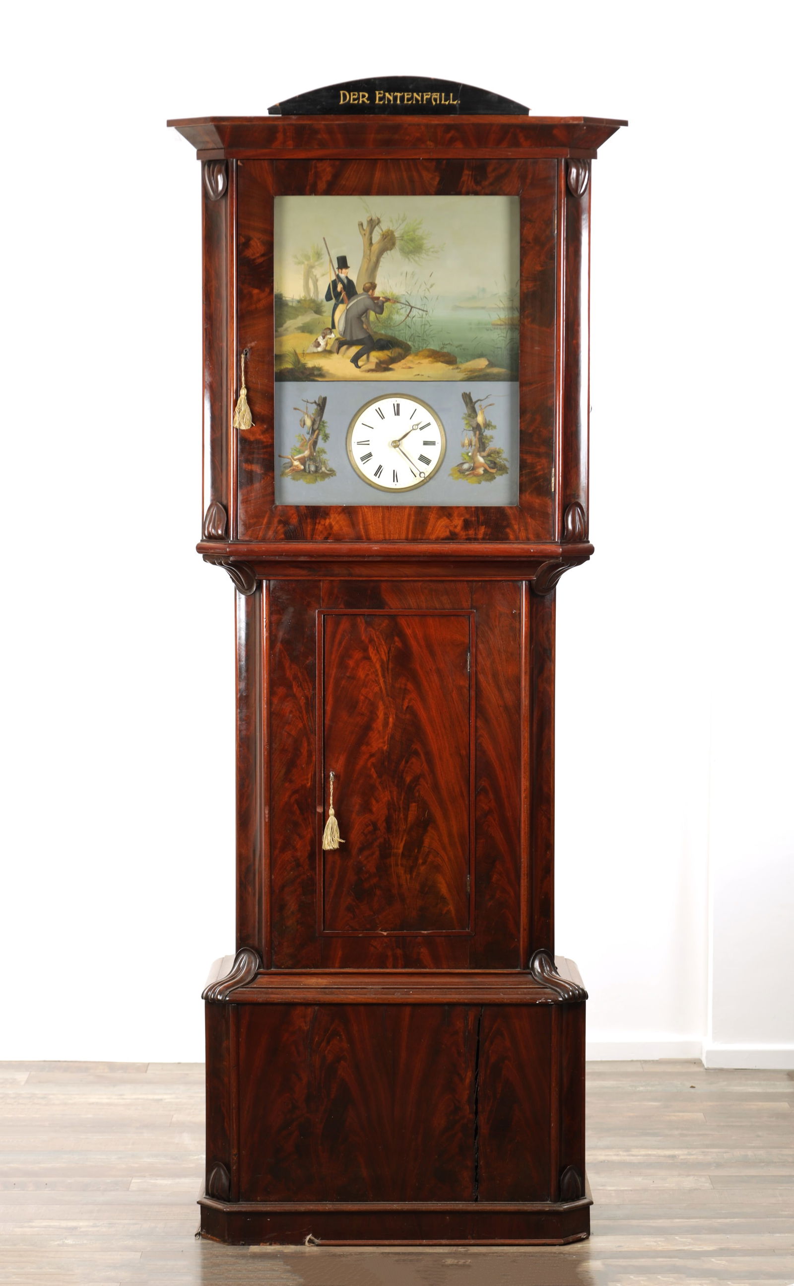 IGNAZ SCHOEPPERLE, LENZKIRCH. AN EARLY 19TH CENTURY GERMAN MUSICAL ORGAN LONGCASE CLOCK: IGNAZ SCHOEPPERLE, LENZKIRCH. AN EARLY 19TH CENTURY GERMAN MUSICAL ORGAN LONGCASE CLOCK the figured mahogany case with concave leaf carved canted corners enclosing a beautifully painted dial with a du