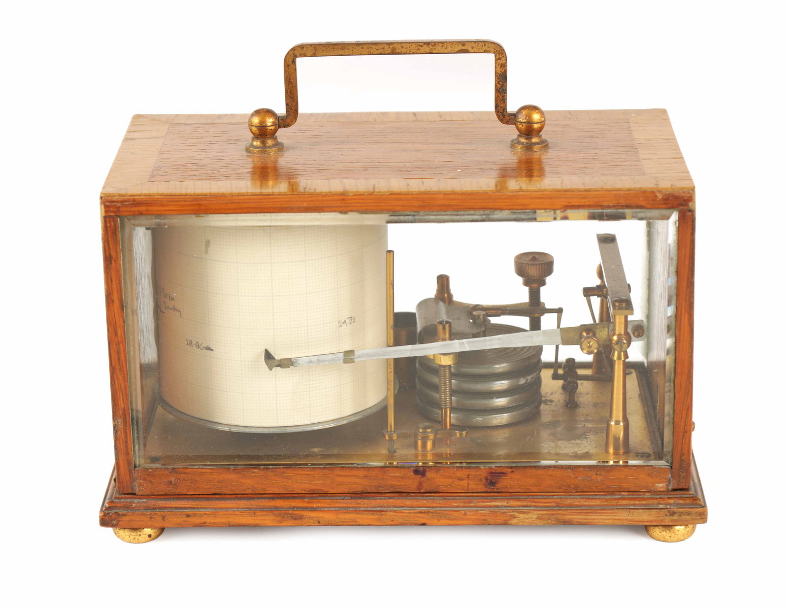 AN EARLY 20TH CENTURY MINIATURE BAROGRAPH: AN EARLY 20TH CENTURY MINIATURE BAROGRAPH with oak crossbanded case and bevelled glass sides enclosing a spring-driven drum and silvered bellows (10.5cm high, 18cm wide)