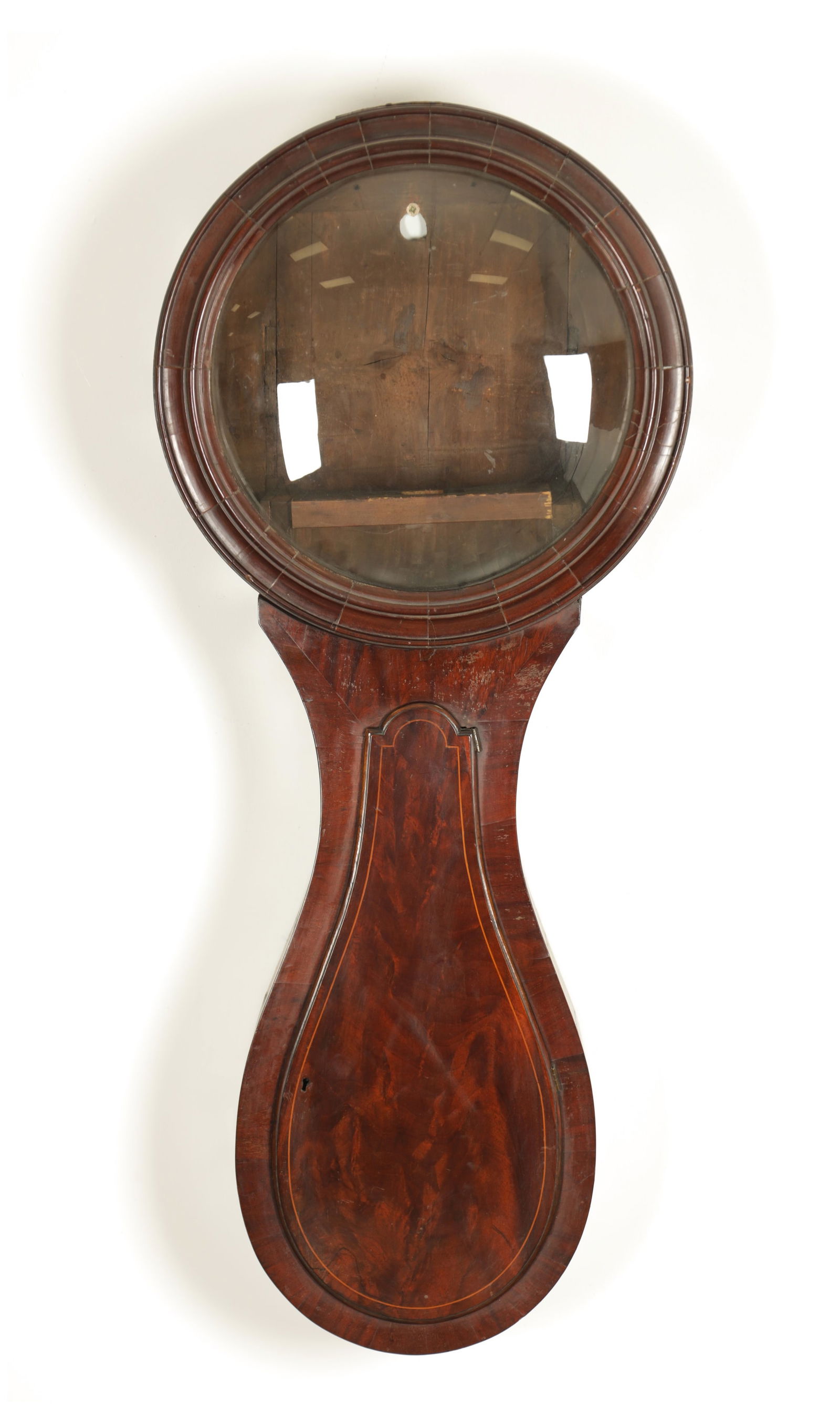 A GEORGE III FLAME MAHOGANY TEAR DROPPED SHAPED TRUNK DIAL CLOCK CASE: A GEORGE III FLAME MAHOGANY TEAR DROPPED SHAPED TRUNK DIAL CLOCK CASE with convex hinged glass and boxwood strung inlaid trunk door; aperture would fit a 14" dial. (105cm high)