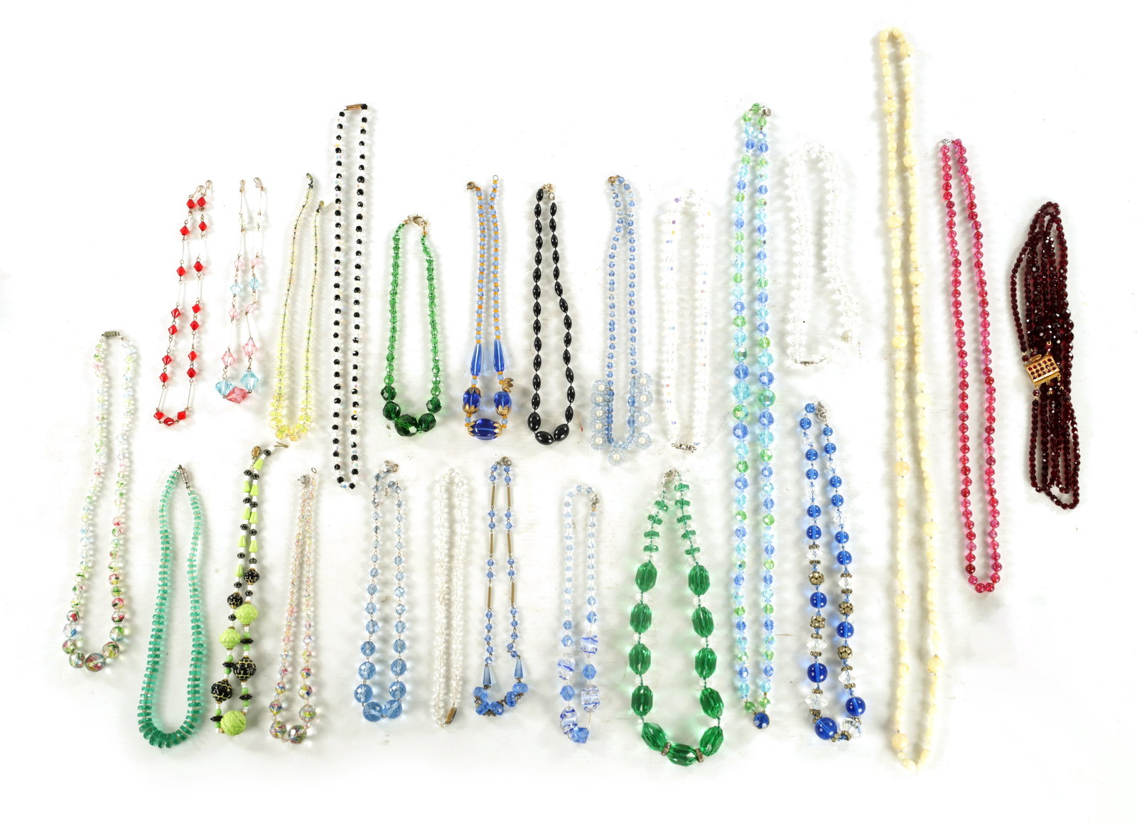 A LARGE COLLECTION OF VINTAGE GLASS BEADED NECKLACES: A LARGE COLLECTION OF VINTAGE GLASS BEADED NECKLACES twenty-four in total.