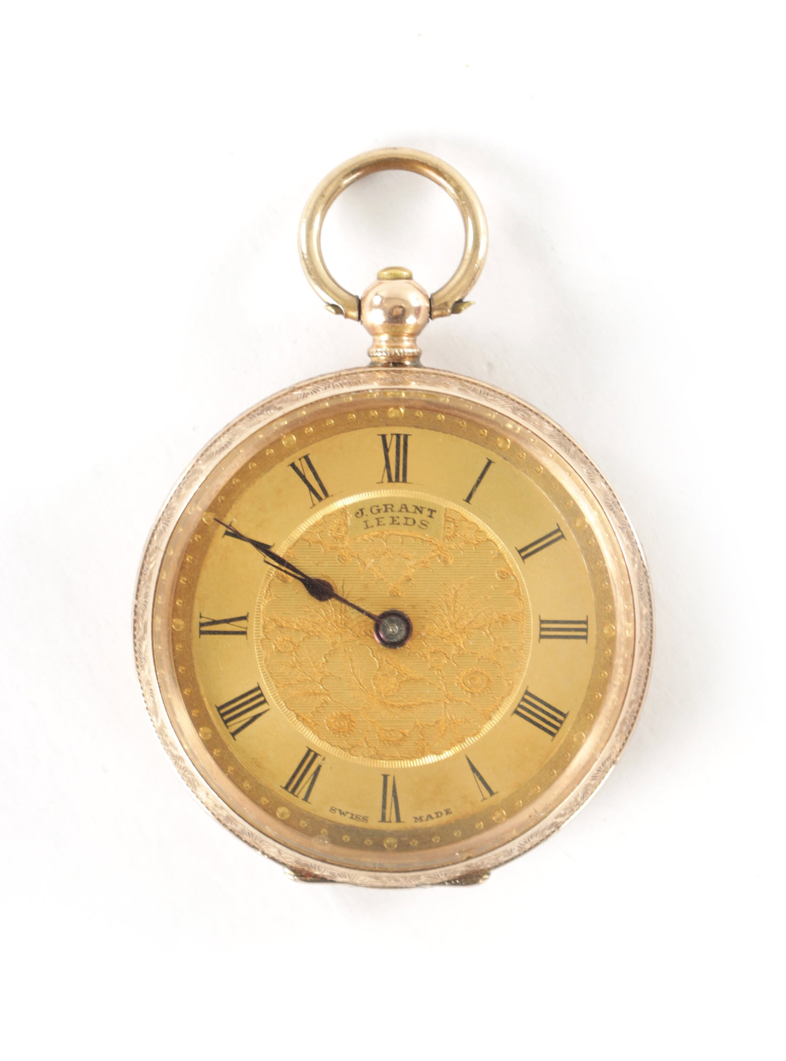 A 9CT GOLD LADIES FOB WATCH: A 9CT GOLD LADIES FOB WATCH having an engraved open face case, gold dial signed J. Grant, Leeds fronting a key wound spring-driven movement. Total weight app. 26.9g (34mm diameter)