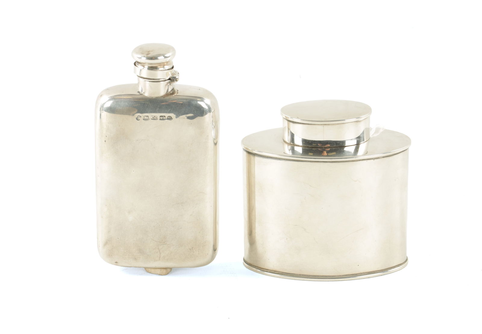 A VICTORIAN SILVER HIP FLASK AND AN EDWARDIAN SILVER TEA CADDY: A VICTORIAN SILVER HIP FLASK AND AN EDWARDIAN SILVER TEA CADDY