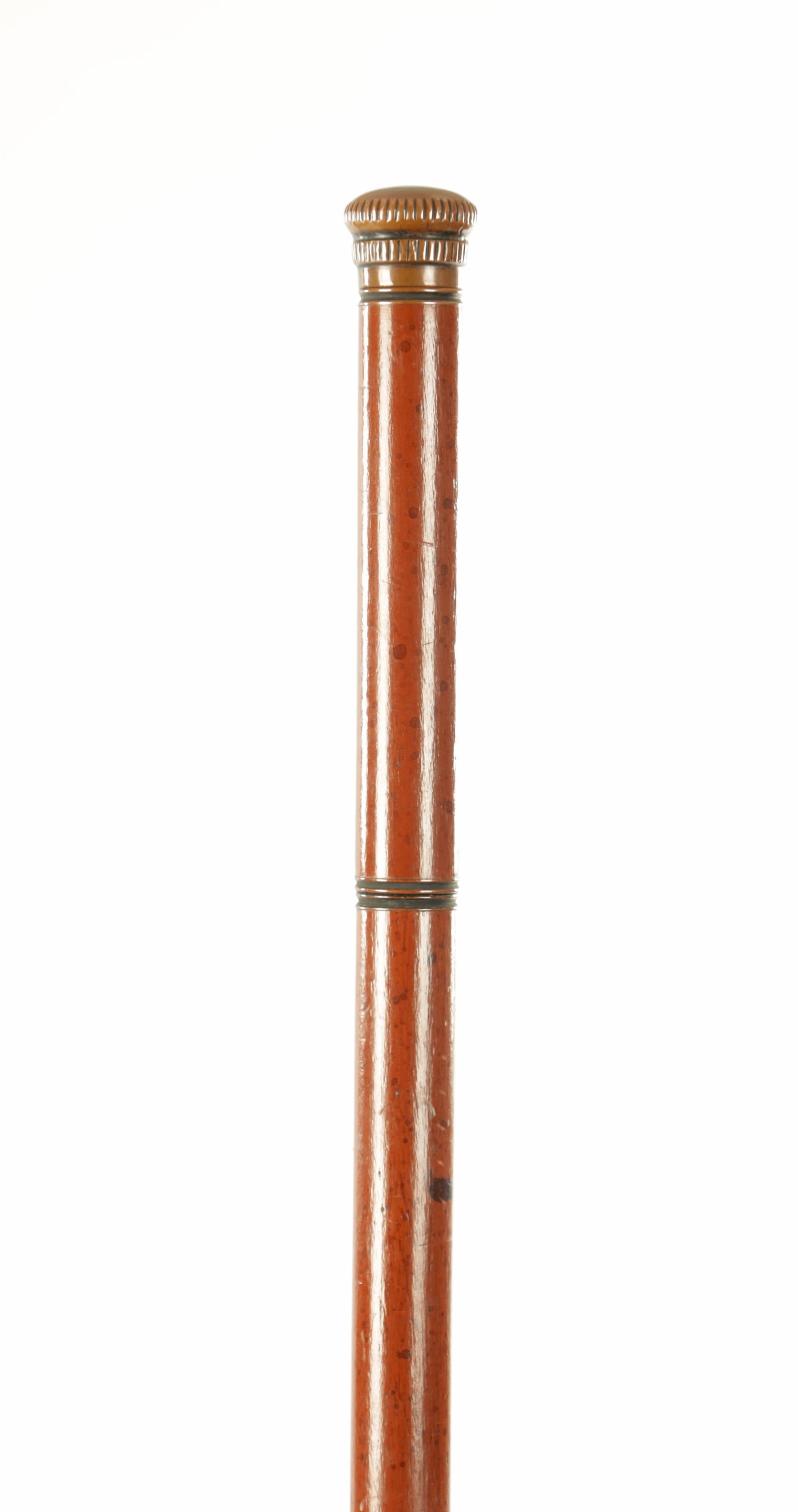AN EARLY 20TH CENTURY FLASK MALACCA WALKING STICK: AN EARLY 20TH CENTURY FLASK MALACCA WALKING STICK the top screws off to reveal a small drinking glass, the centre screws off to reveal a long glass drinks flask (90cm overall )