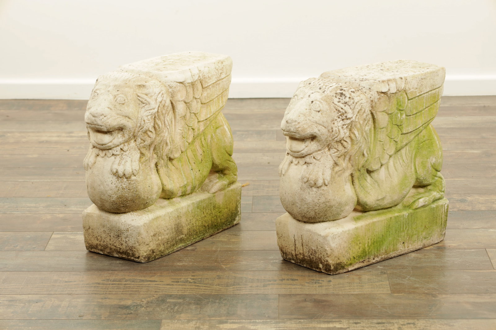 A PAIR OF CARVED SANDSTONE WINGED LIONS (1 of 8)