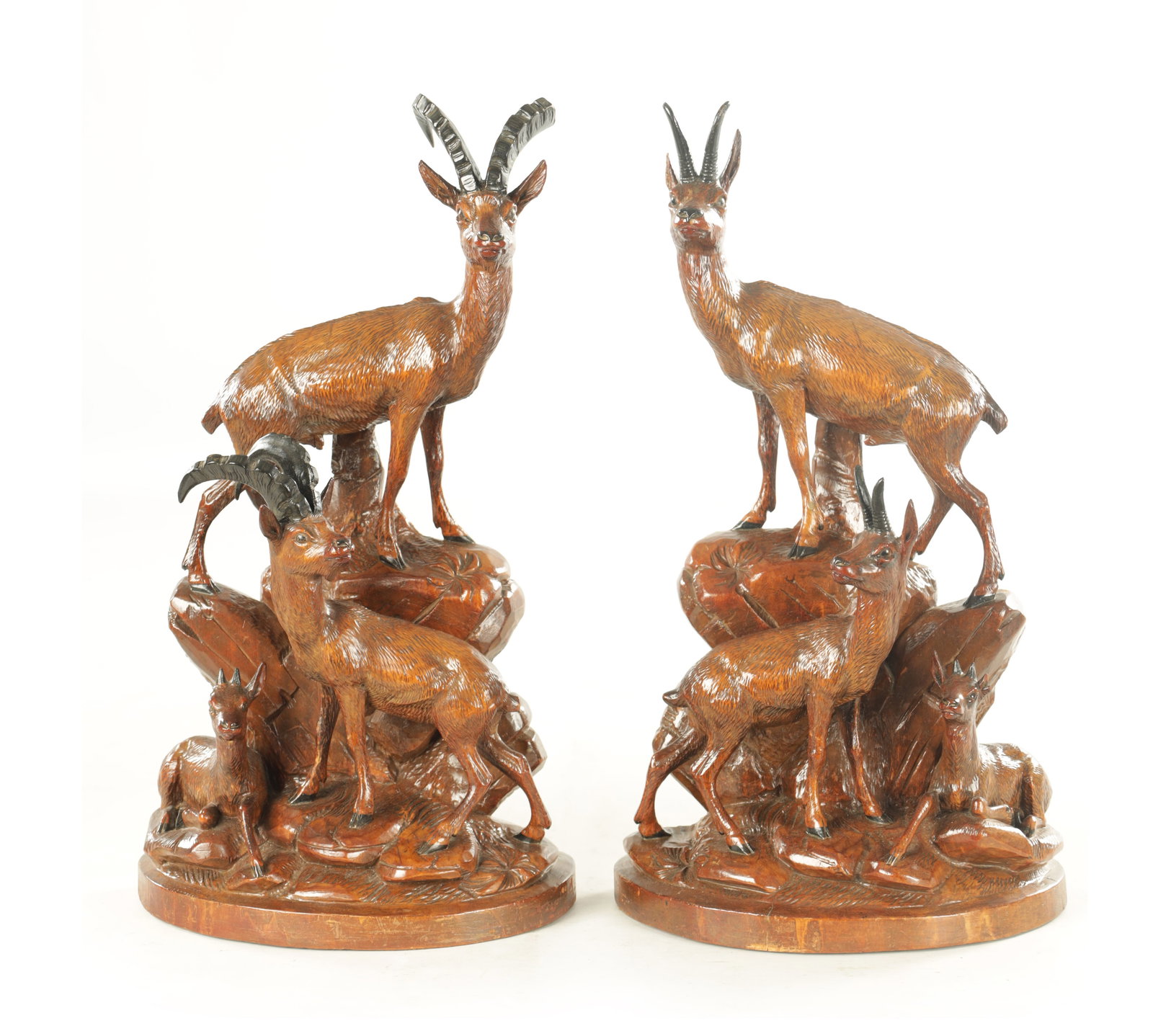 A PAIR OF 19TH CENTURY BLACK FOREST CARVED LINDEN WOOD SCULPTURES (1 of 9)