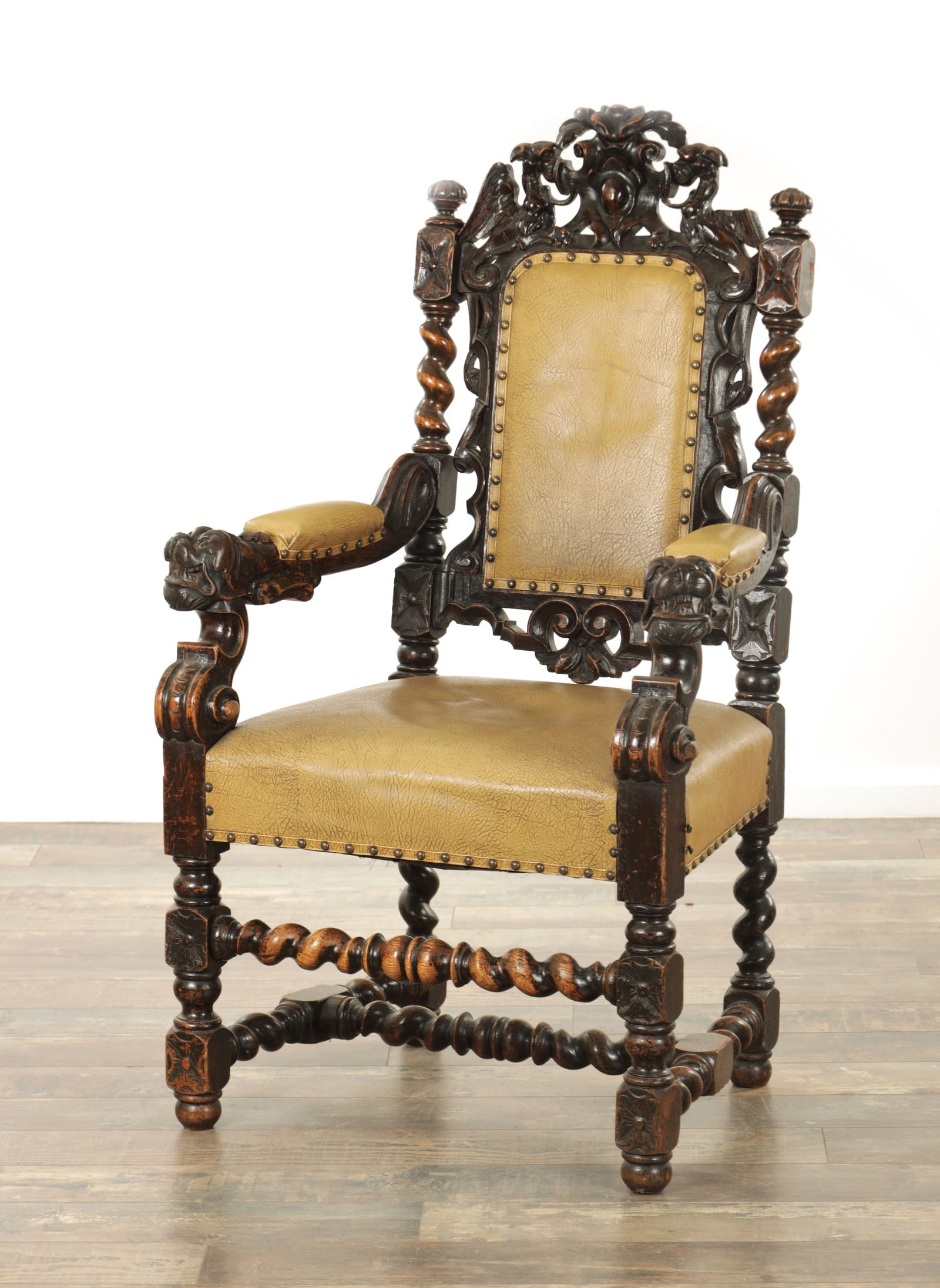 A LATE 19TH CENTURY CARVED OAK ARMCHAIR (1 of 8)